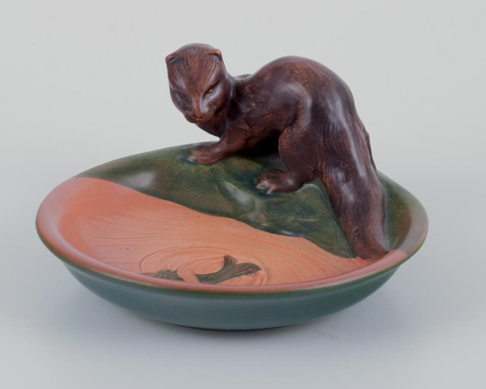 Ipsen's Denmark. Ceramic bowl with otter and fish in the water. Rare model.