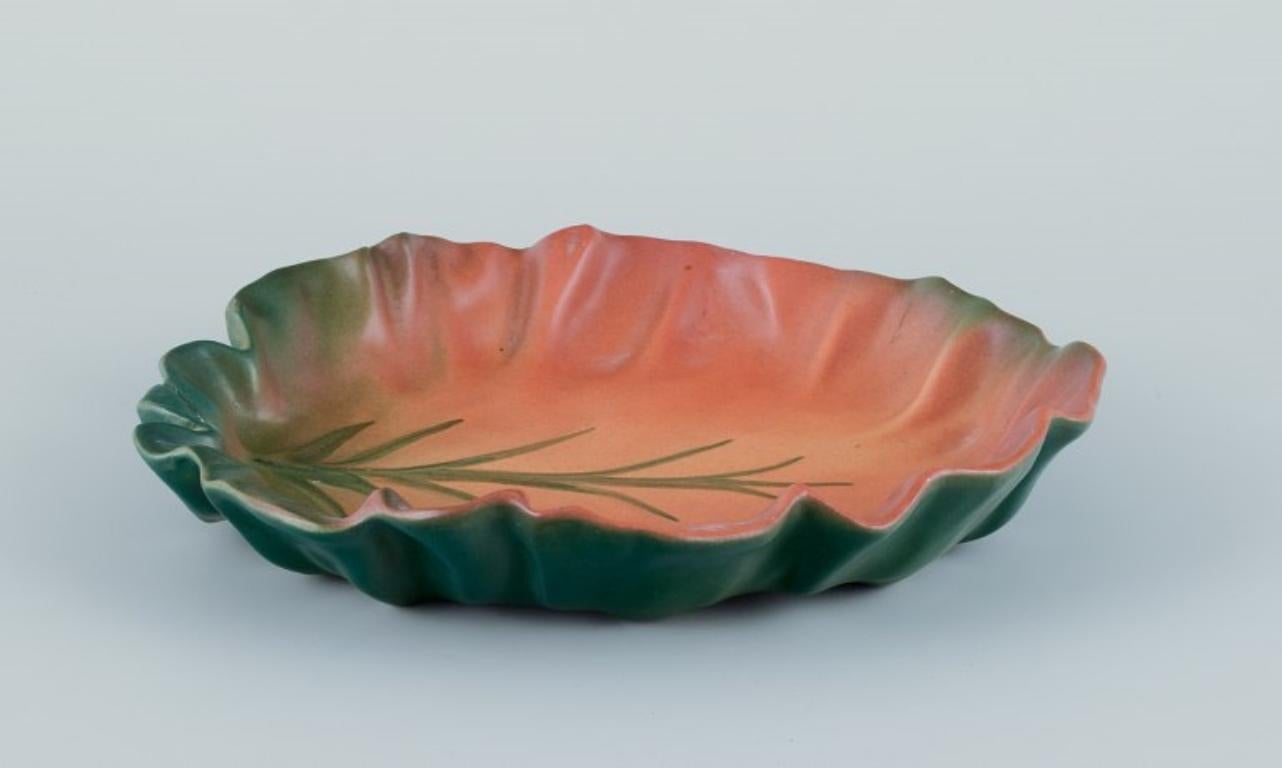 Glazed Ipsens, Denmark. Ceramic bowl with wavy rim. Motif of a plant. 1930s For Sale