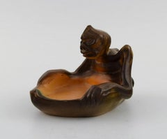 Ipsen's, Denmark. Rare bowl in hand-painted ceramics modelled with grotesque.
