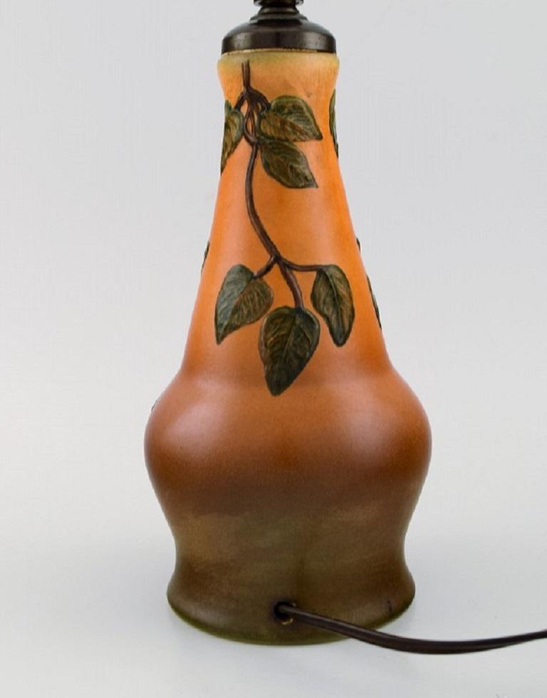 Art Nouveau Ipsen's, Denmark, Table Lamp in Glazed Ceramics with Hand-Painted Foliage