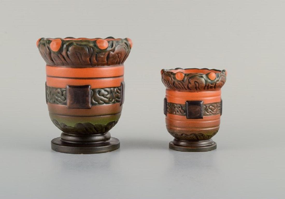 Ipsens Denmark. Two Art Nouveau jars in hand-painted glazed ceramic.
1920s.
In excellent condition.
Marked.
Model 595 measures: H 12.5 x D 10.5 cm.
Model 216 measures: H 9.0 x D 7.0 cm.
