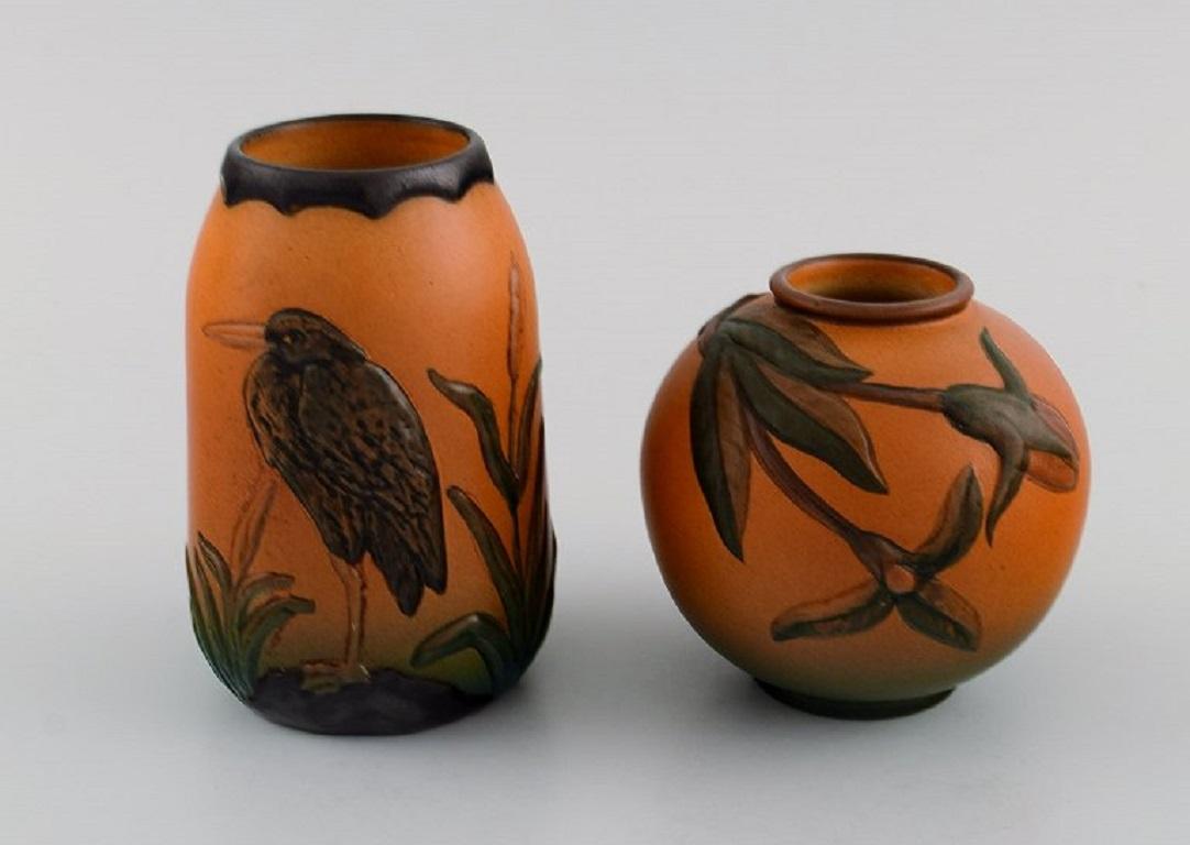 Ipsen's, Denmark. Two vases in hand-painted and glazed ceramics. 
Bird and foliage. 1920s / 30s.
Largest measures: 11.5 x 7.5 cm.
In excellent condition.
Stamped.
Model numbers 731 and 749.