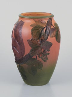 Ipsen's Denmark, vase with squirrel, glazing in orange and green tones.