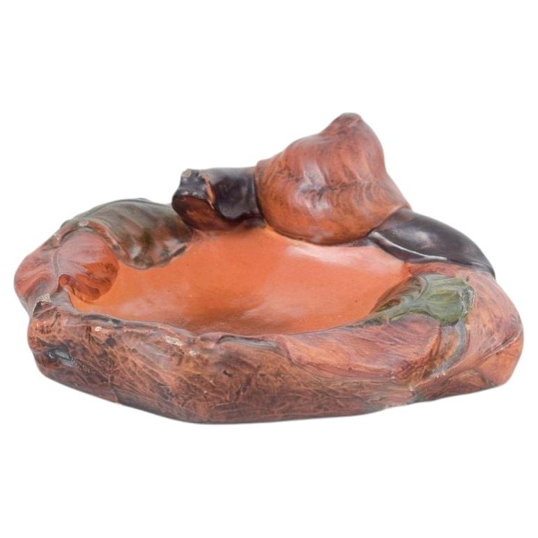 Ipsens Enke, Denmark. Decorative ceramic bowl with snail, 1920s