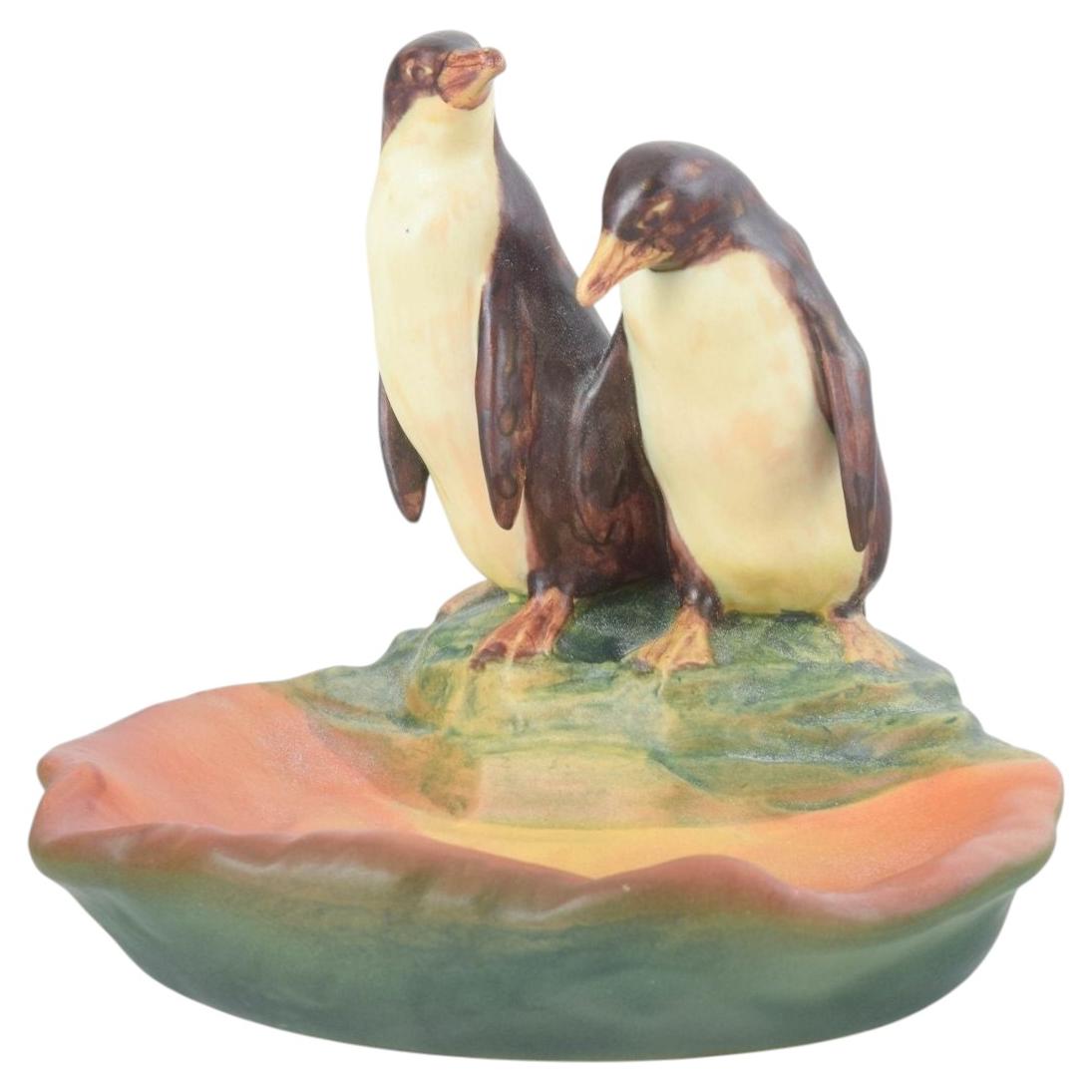 Ipsens Enke, Denmark. Decorative ceramic bowl with two penguins. 1920s