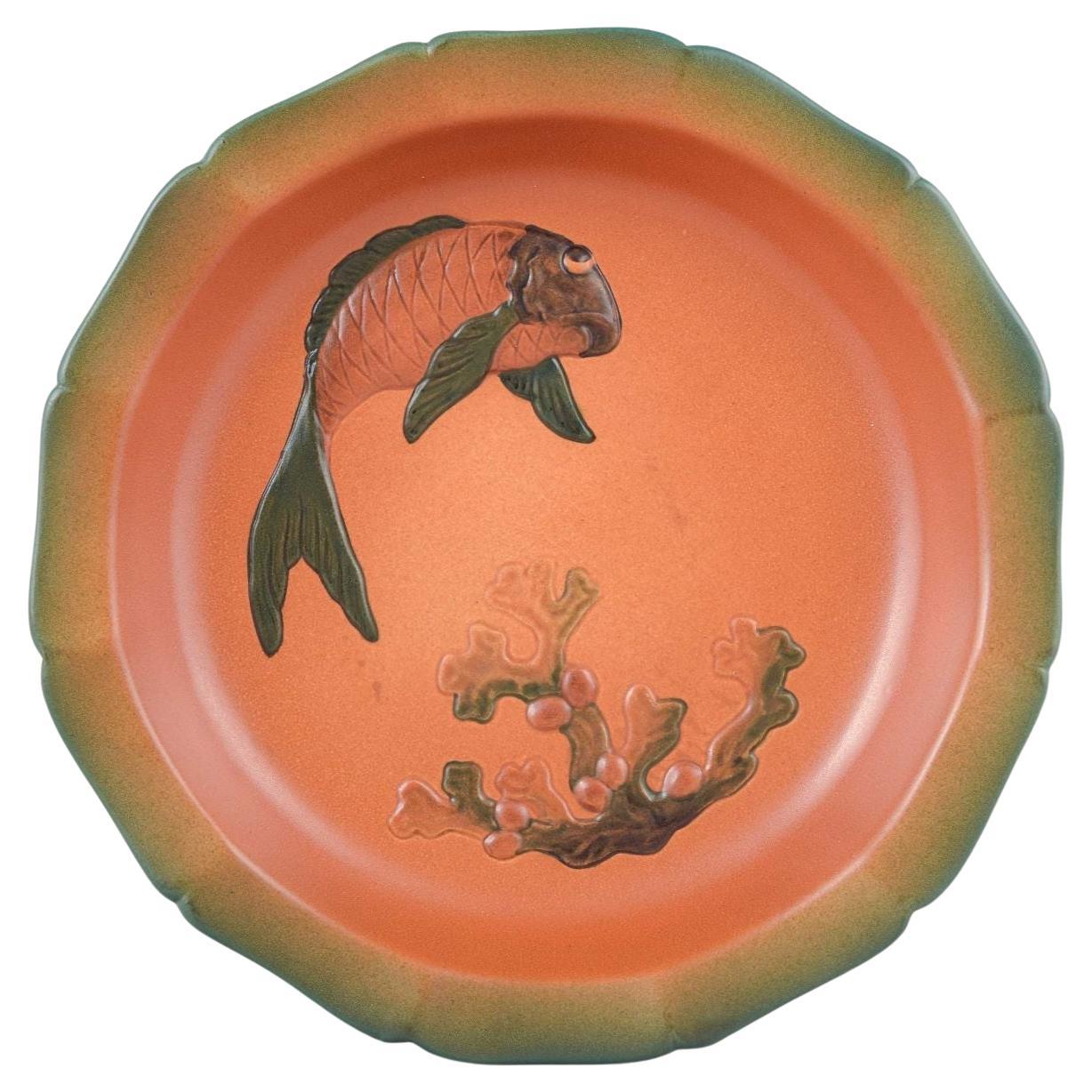 Ipsens Enke. Large ceramic dish with relief decoration of fish and coral For Sale