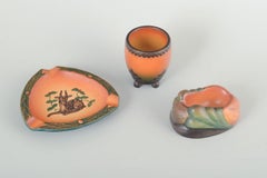 Ipsens Enke. Set of three stoneware pieces: ashtray, vase and pipe holder.