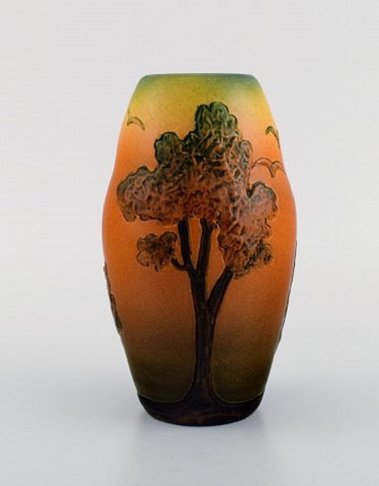 Ipsen's widow, Denmark. Two vases and a small dish in hand painted glazed ceramics. Decorated with trees, berries and foliage, circa 1920.
Largest measures: 16.5 x 9.5 cm.
In excellent condition.
Stamped.