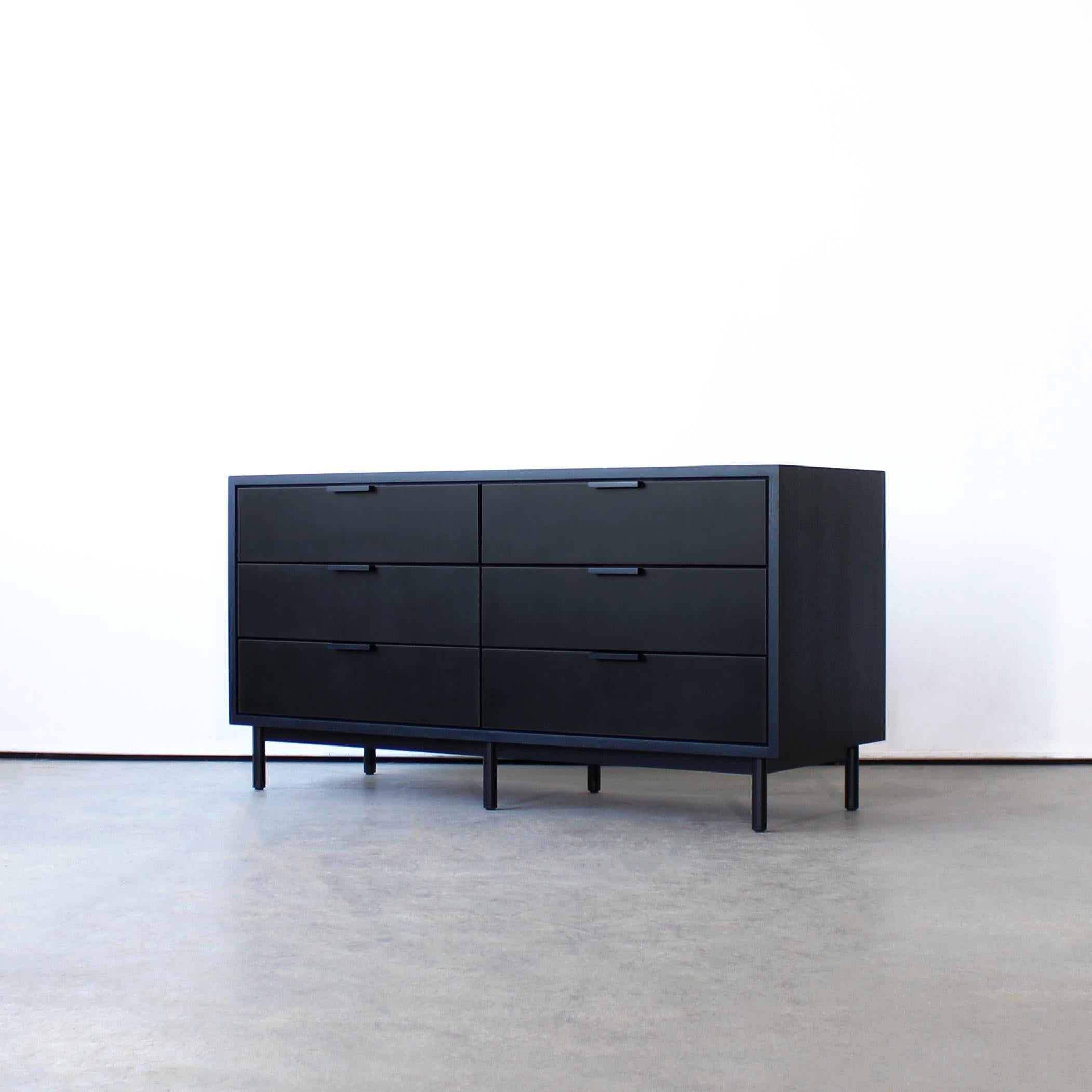Ira Dresser by Crump and Kwash 

Solid wood case / leather wrapped or solid wood drawer faces / dovetailed solid wood drawer boxes / premium, full extension, soft close drawer slides / solid steel base and pulls

This piece is new and made to