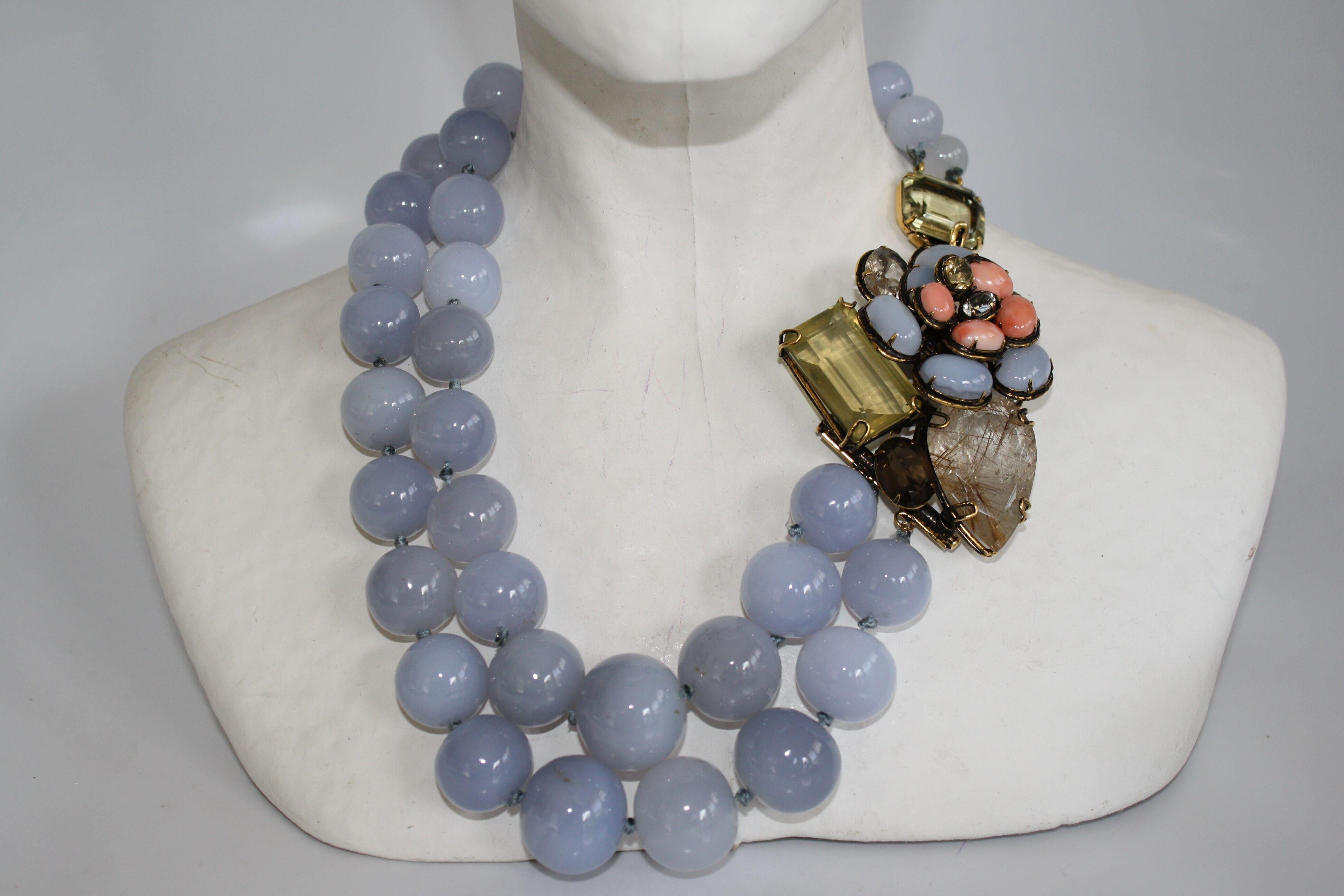 Calcedony, coral, citrine, quartz, and topaz necklace from Iradj Moini. Floral closure is also a pin that can be removed and worn separately. 

Pin is 3