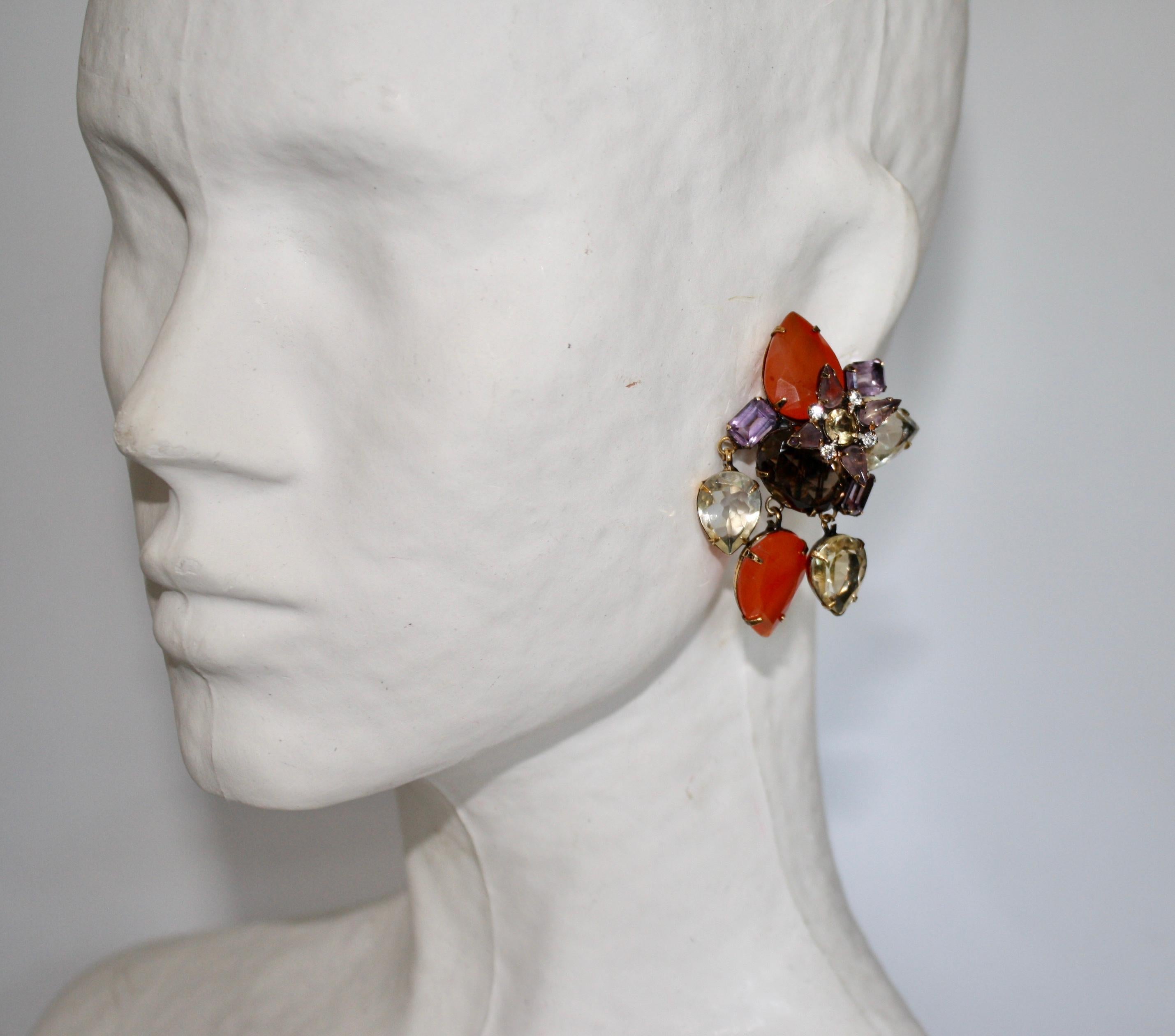 Handmade extraordinary clip earrings from Iradj Moini. Comprised of carnelian, amethyst, and smoky quartz. 