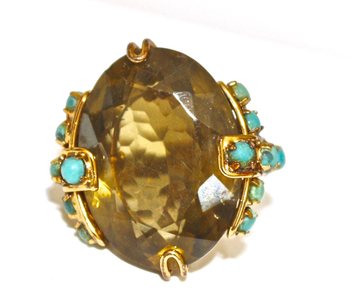 Citrine center stone ring with turquoise detailing from Iradj Moini. Ring is size adjustable and fits fingers sized from 6-8. 