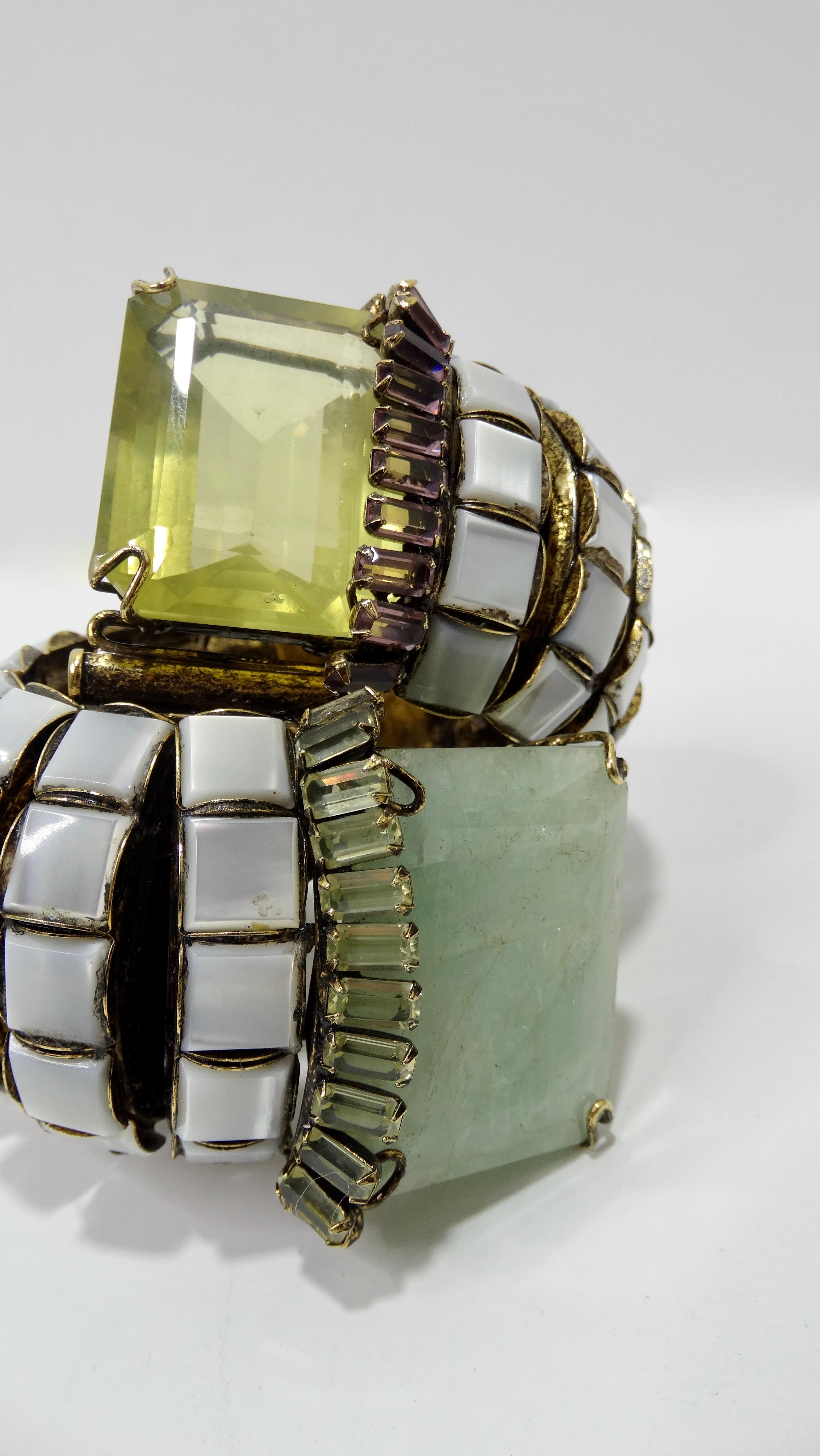 Make a statement with this stunning cuff! Custom made, this brass spiral cuff features rows of square-cut Mother of Pearl with a large Baguette-cut Jade and Lemon Quartz that are trimmed with a single row of smaller baguette-cut Amethyst and Jade.