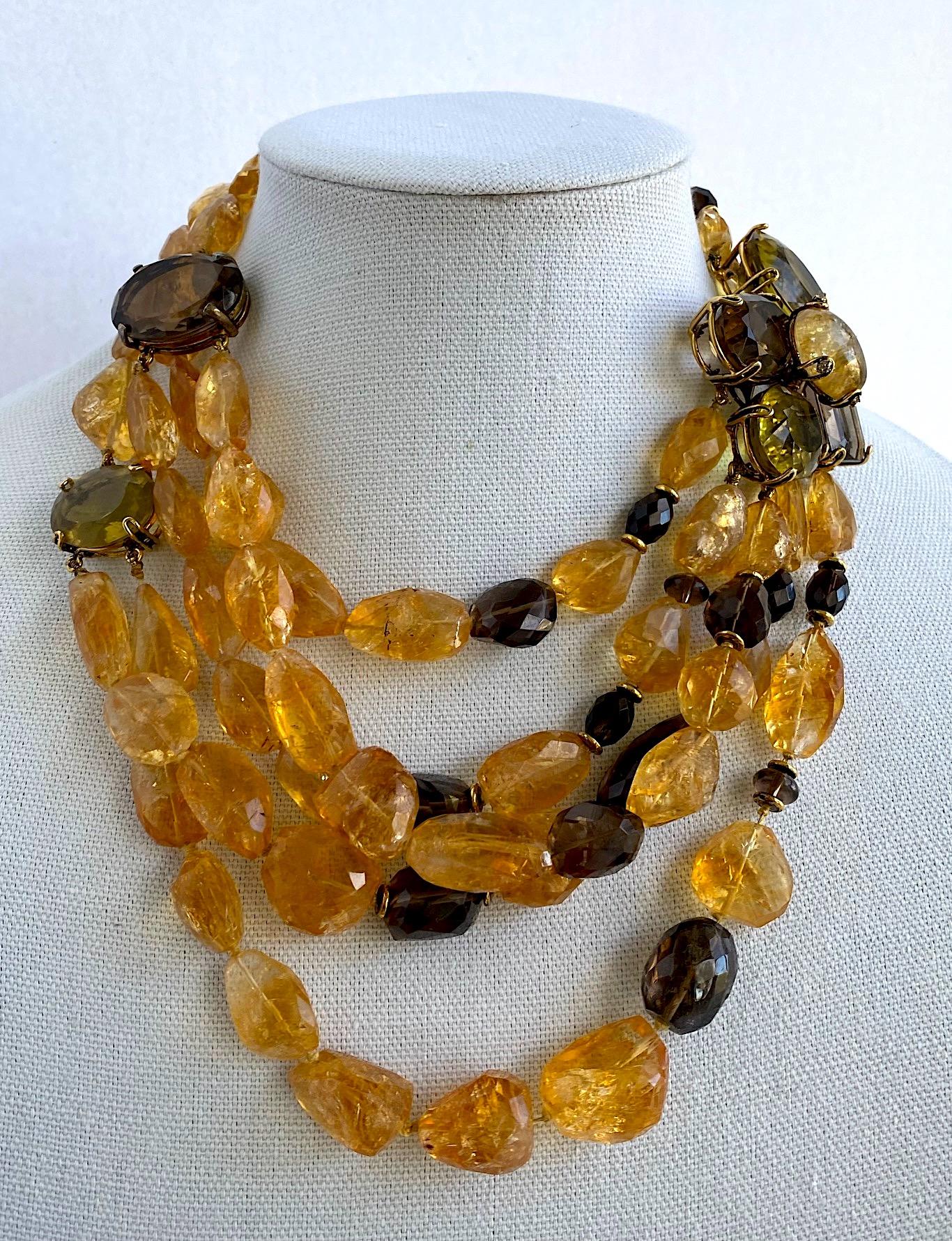 A stunning necklace of natural semi precious stones by famed jewelry designer Iradj Moini. One end of the necklace starts with three strands while the other end of the necklace starts with five strands. The strands are comprised of faceted irregular