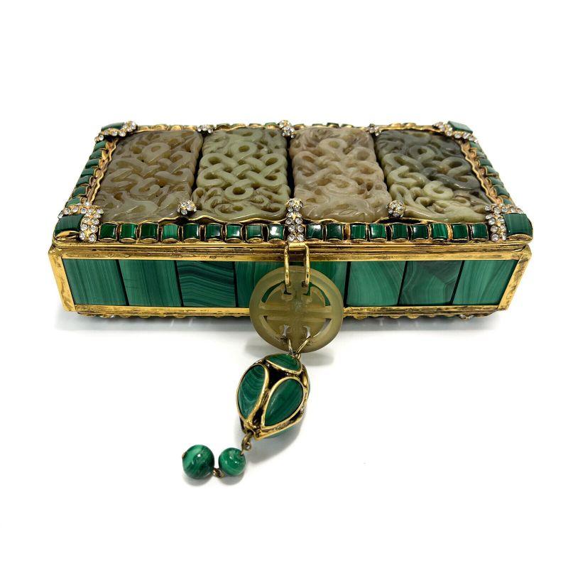 Iradj Moini Oriental Statement Clutch, Malachite Carved Jade and Faux Diamonds

A stunning Iradj Moini Oriental statement clutch. Chinoiserie style with 8 hand carved apparent jade tablets in a braided snake texture. Malachite square panels