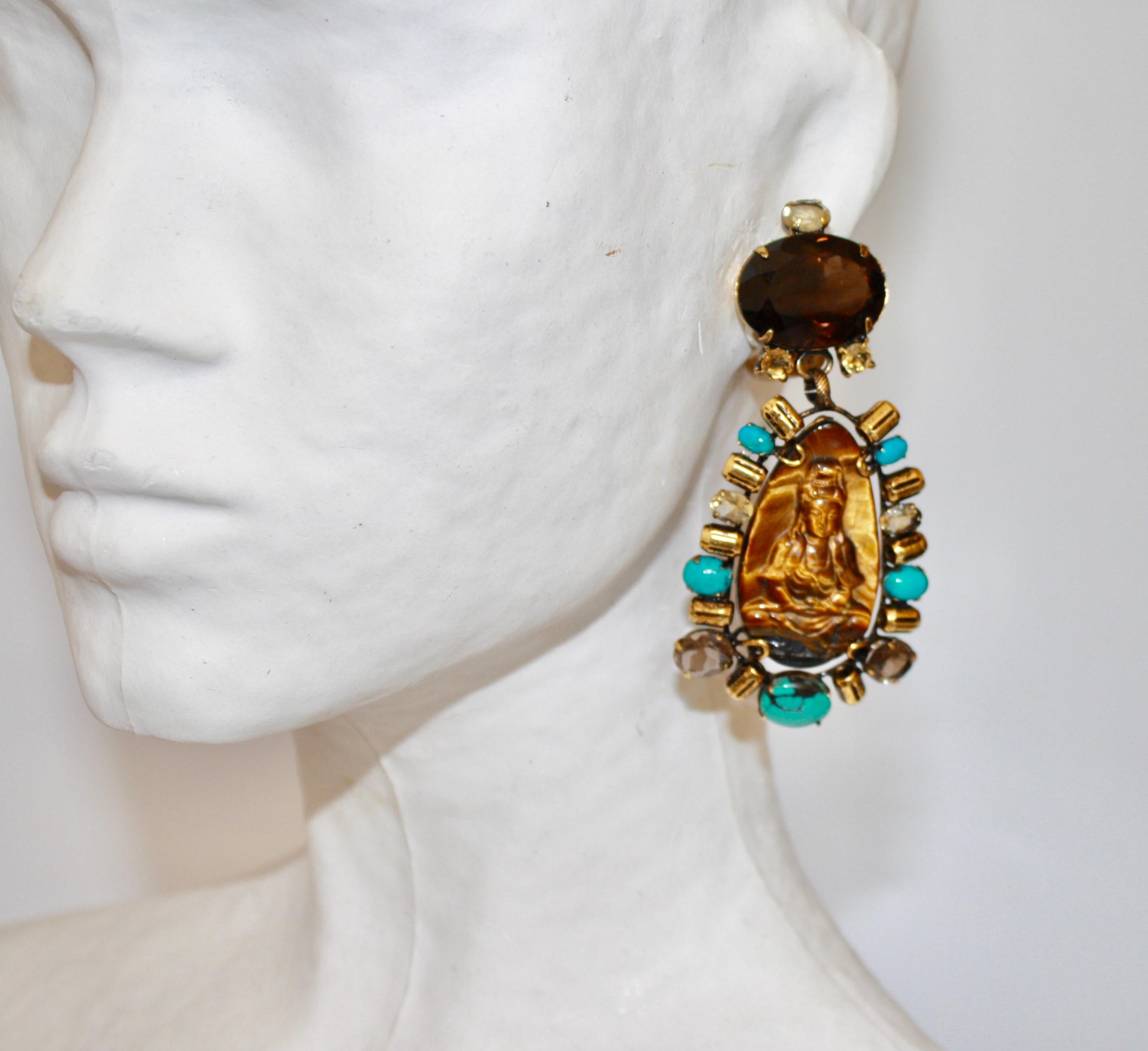 Turquoise, tigers eye, smoky quartz, and lemon quartz clip earrings with carved Buddha motif from Iradj Moini. 