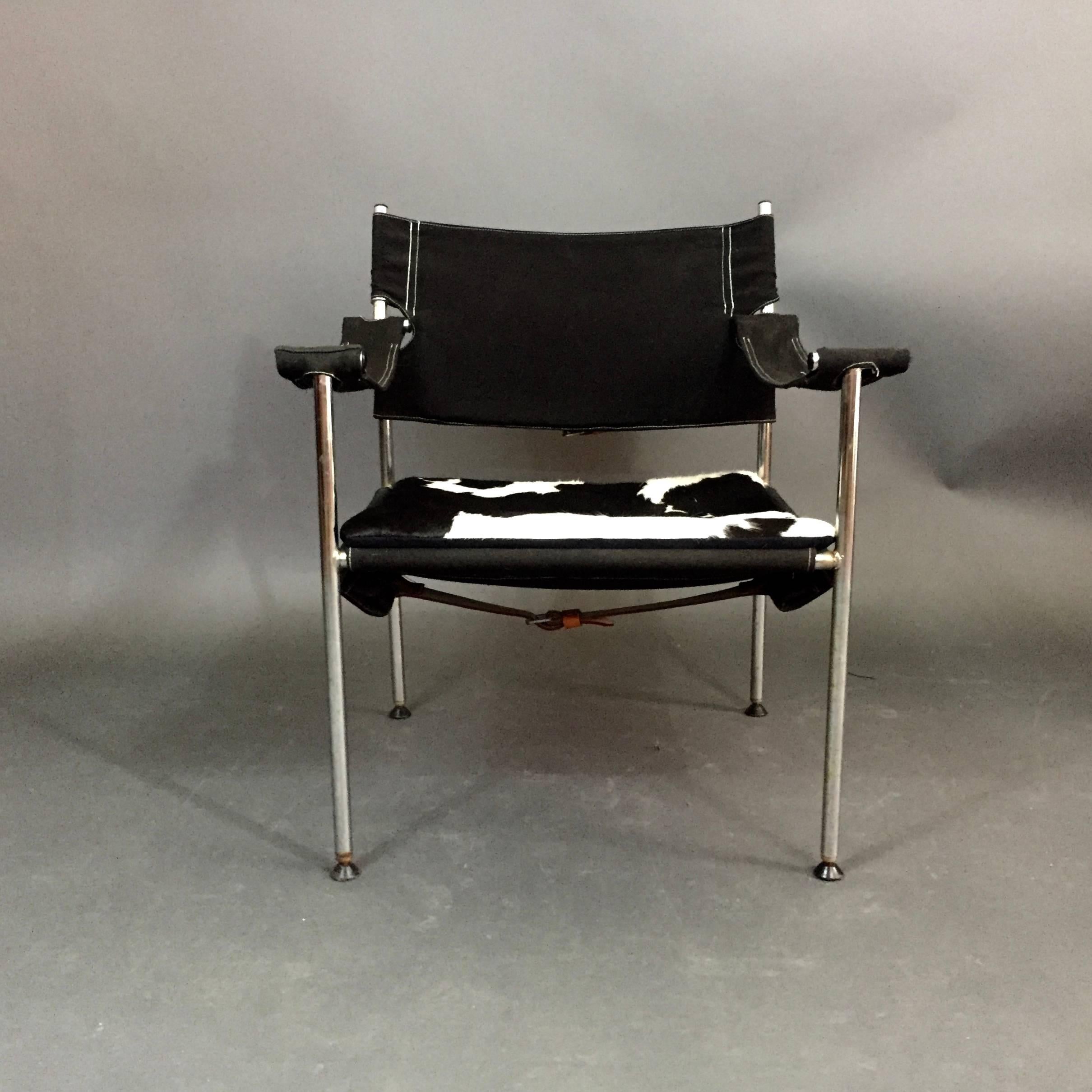 Designed by Sigurd Resell & Cato Mansrud for Anders Grasaasen's Fabrikker in Norway, circa 1965. The chair has a flexible chrome frame with black canvas sling support to seat, back and arms. Original and unique plastic foot pads. Back and underside