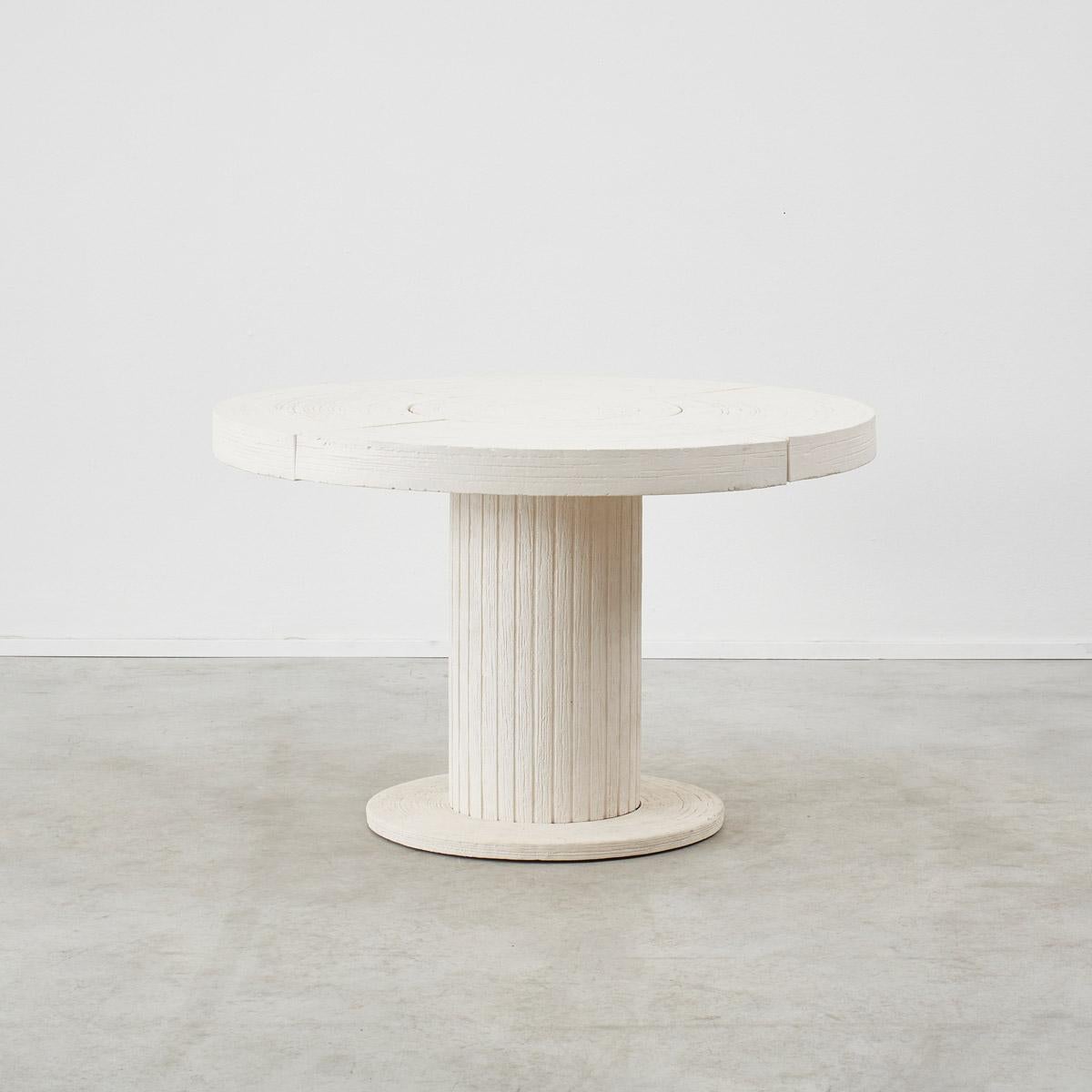 An artistically crafted custom ceramic centre table designed by Irakli Zaria for a West London interior. With a round top raised on a fluted column, on a plinth base, it imparts a classicism to its contemporary design. This distinctive piece carries