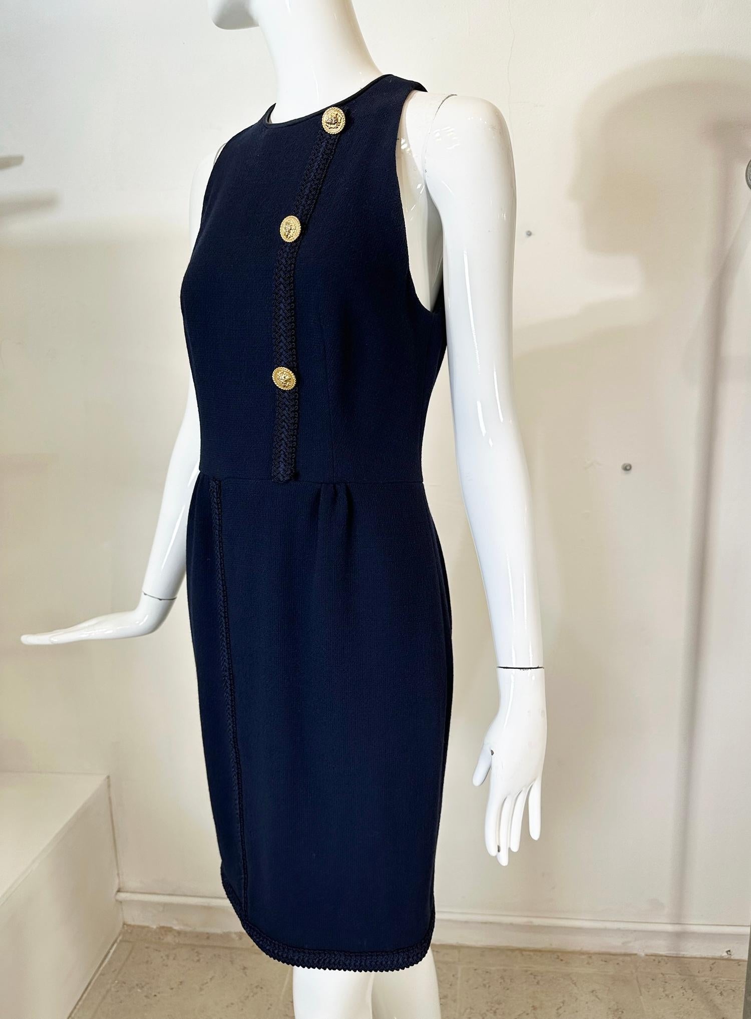 Irene Galitzine Couture navy blue wool racer neck, fitted sheath, braid trim dress. Navy blue wool dress has cut in shoulders with a round neck, the dress is fitted through the bodice, with a vertical navy blue decorative braid down the side, there