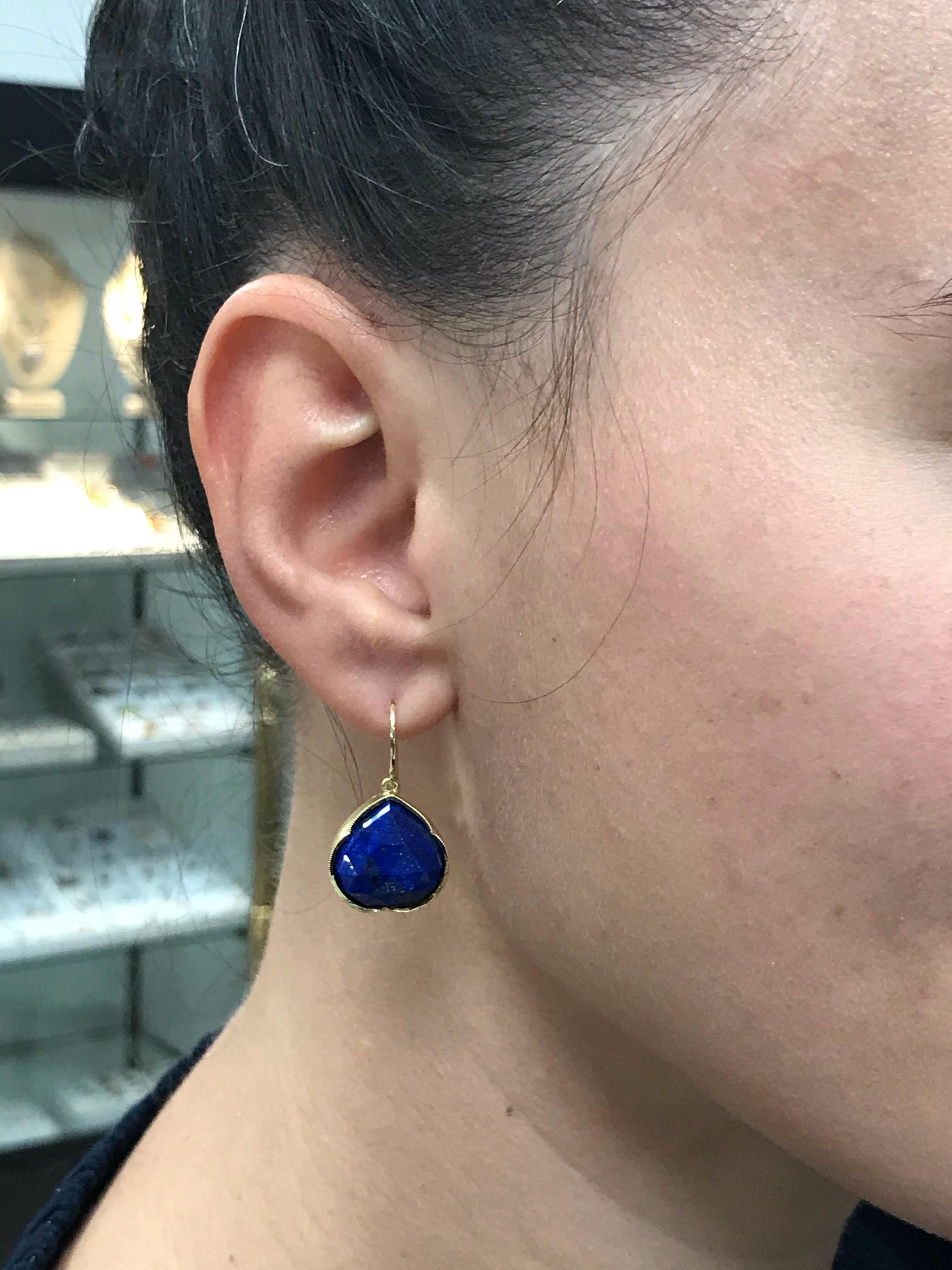 Irene Neuwirth 18k yellow gold earrings with faceted dark blue lapis and French hooks. Stamped by Irene Neuwirth maker's mark and a hallmark for 18k gold. Measurements: 1 1/4
