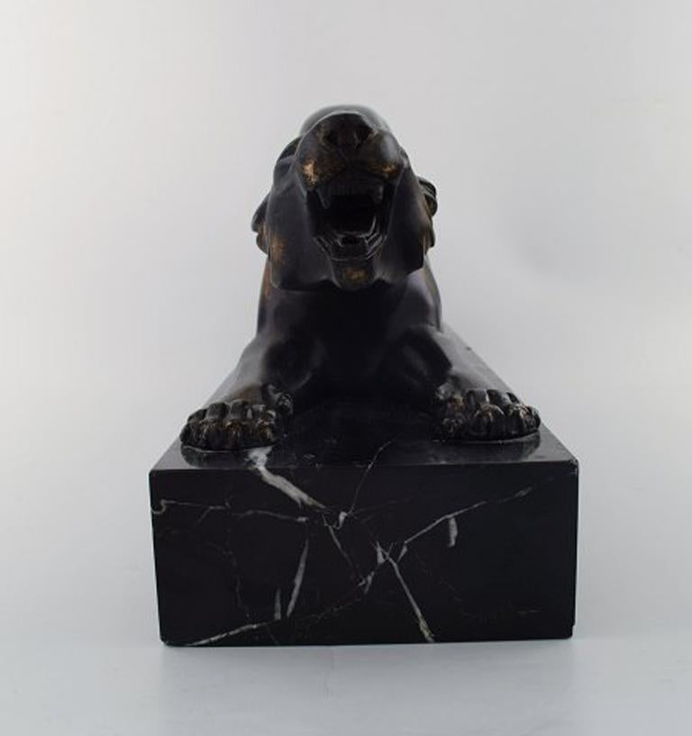Irenee Rochard (1906-1984). A patinated bronze of a panther on base in black marble, signed 