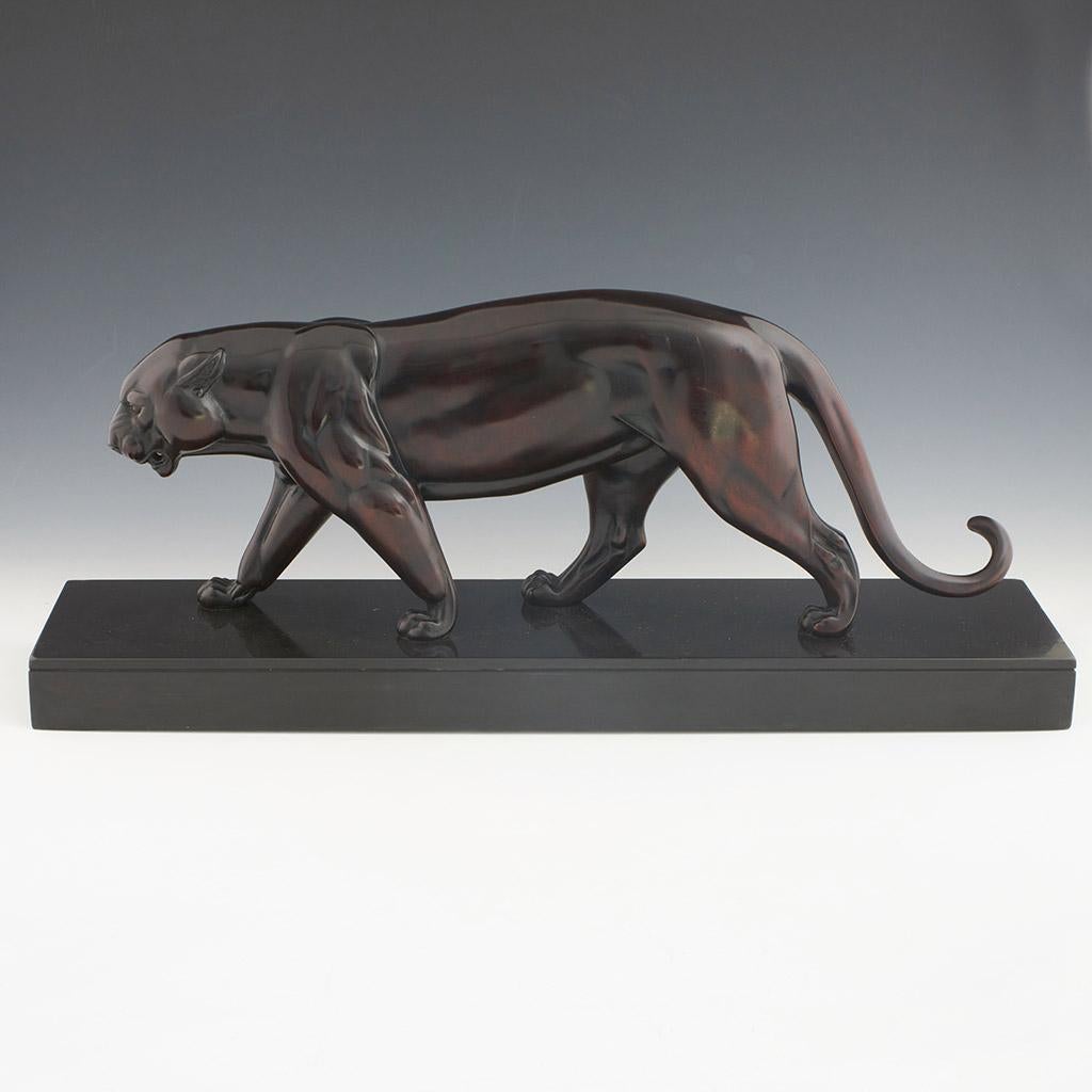 Panthére Marchant, A striking Art Deco sculpture by Irenée Rochard (1906-1984) of a striding panther. Solid bronze, set over a black marble base. Signed 'Rochard' to base. 

Dimensions: H 24cm W 58cm D 14cm 

Origin: French

Date: circa 1935