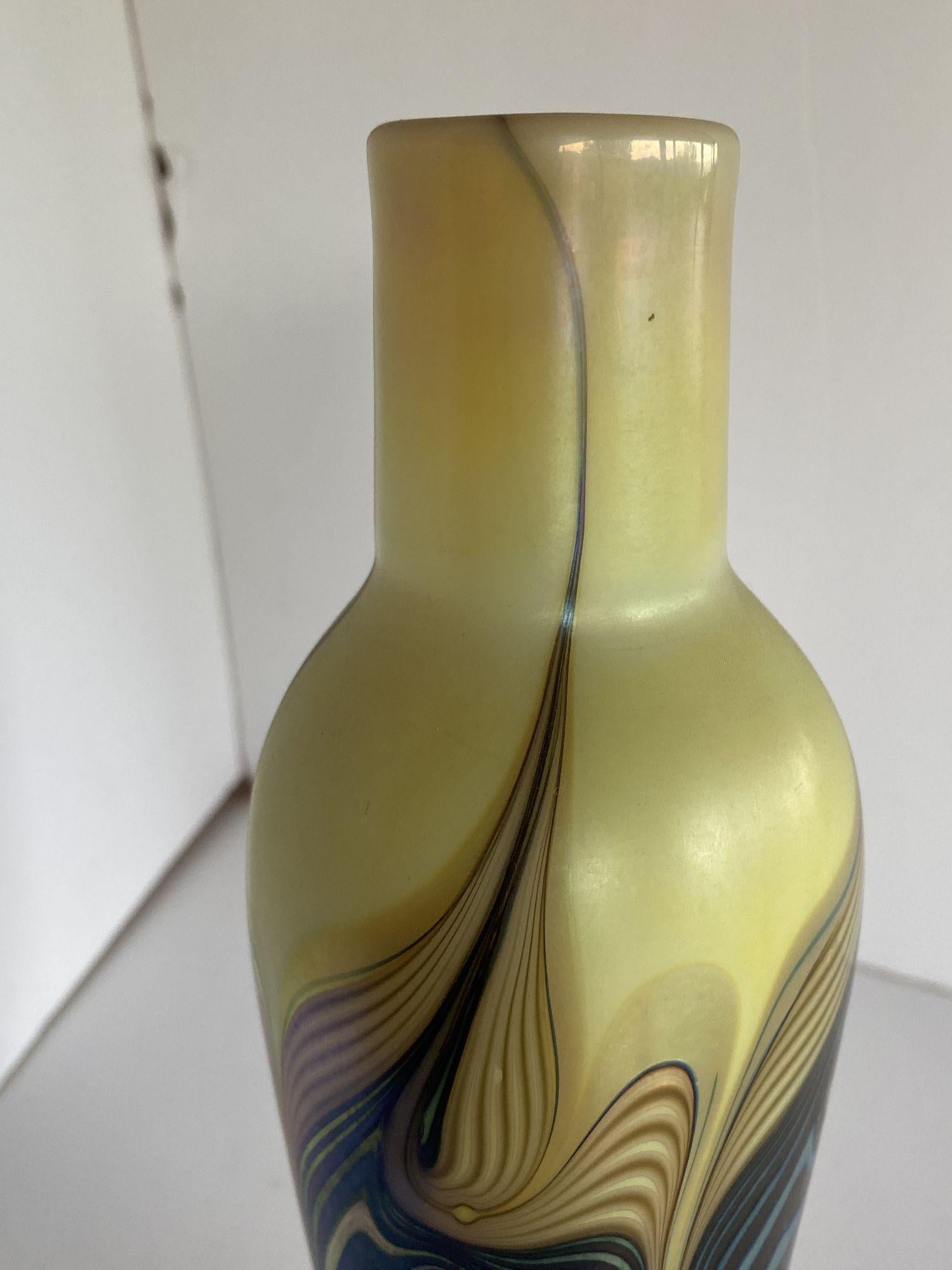 Iridescent 7 color art glass vase flower vase with a varied ripple pattern.

Signed: 