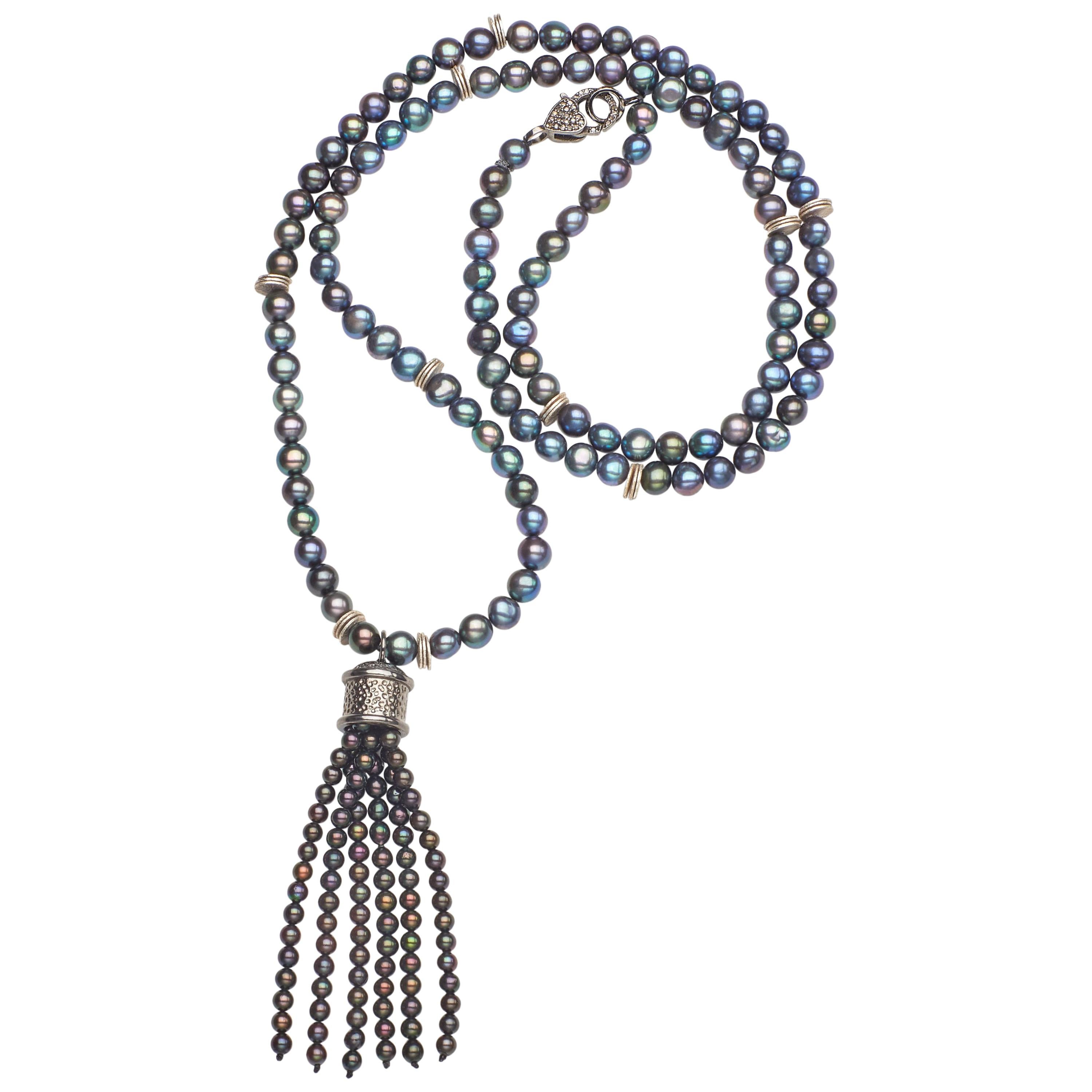 Fabulous to wear on a sweater or dress, this great statement piece can be easily complimented with your sterling accessories. In rich, deep slate blues and grays, this 28 inch necklace of irradiated 5-3/4mm Akoya pearls leads to a flirty 2 1/2 inch