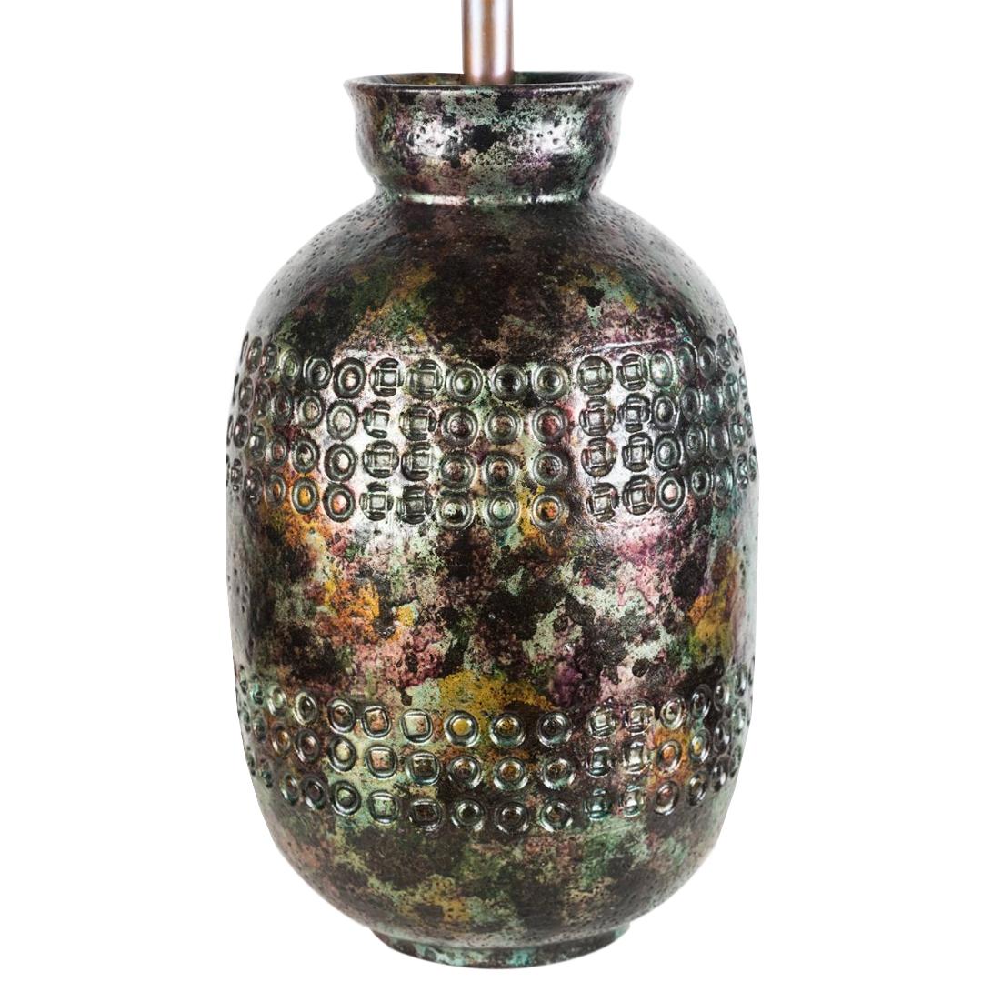 Midcentury iridescent Bitossi table lamp for Raymor, Italy, circa 1950s.
Single socket, antiqued bronze stem. Black twisted silk cord. Shade not included.