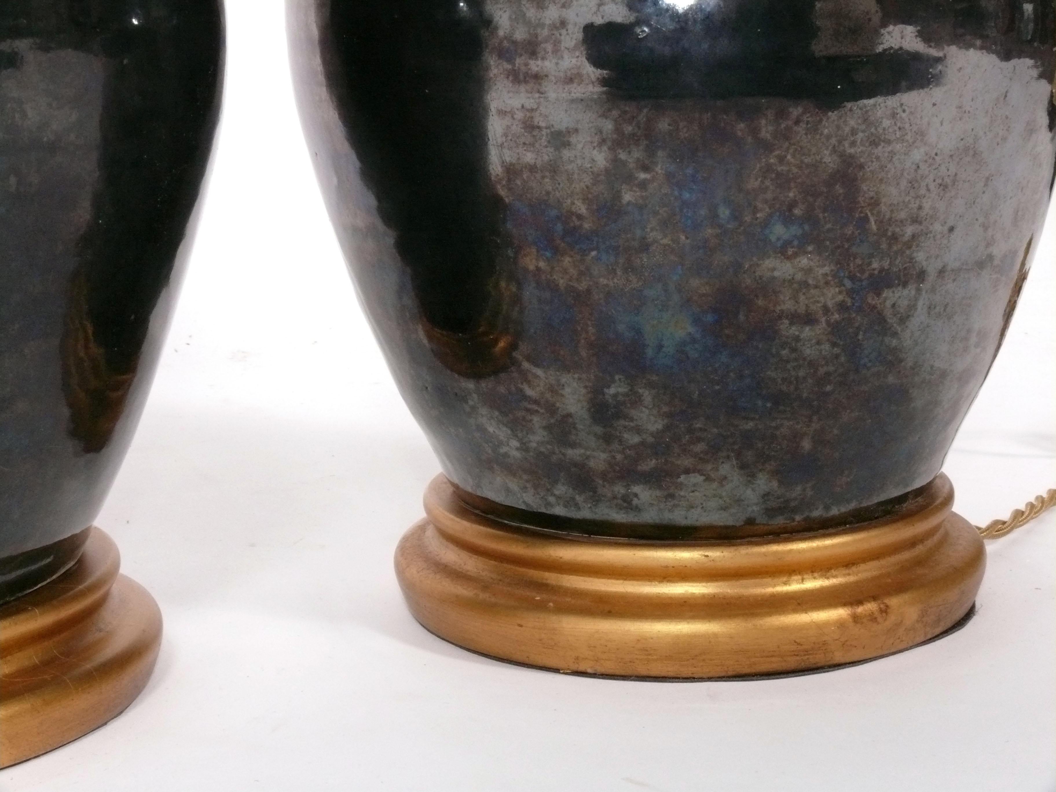 American Iridescent Black Ceramic Lamps with Gilt Wood Bases