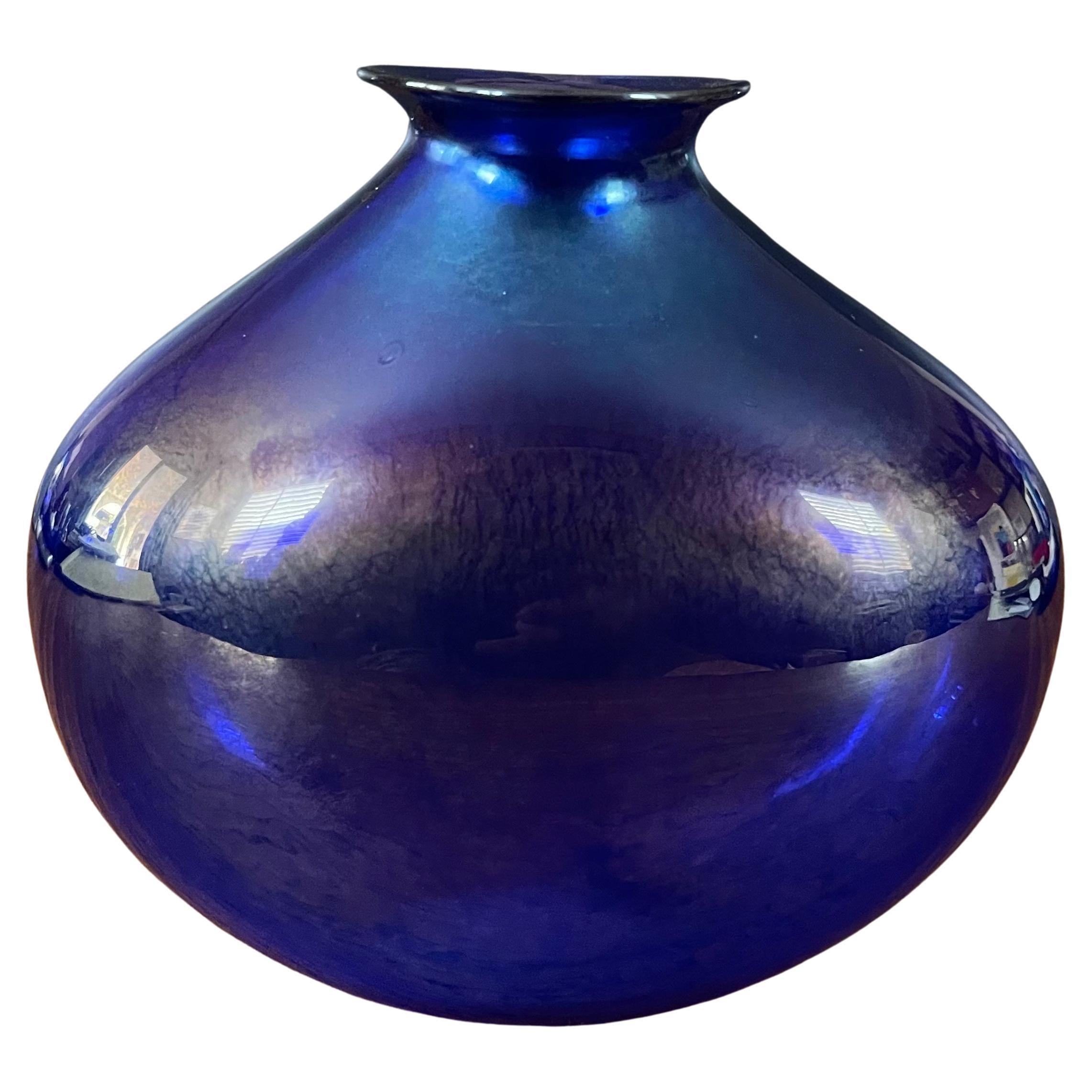 Stunning iridescent blue Aurene art glass vase by Claude Duperron, circa 1988. This vase is in very good vintage condition with no chips or cracks and measures 7