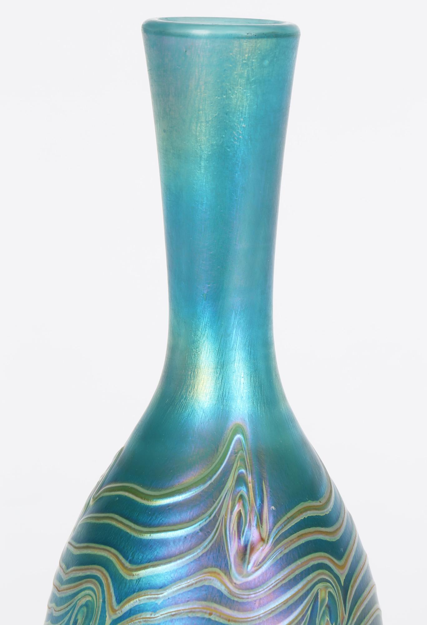 British Iridescent Blue Bottle Shaped Art Glass Vase with Peacock Feather Trailing For Sale
