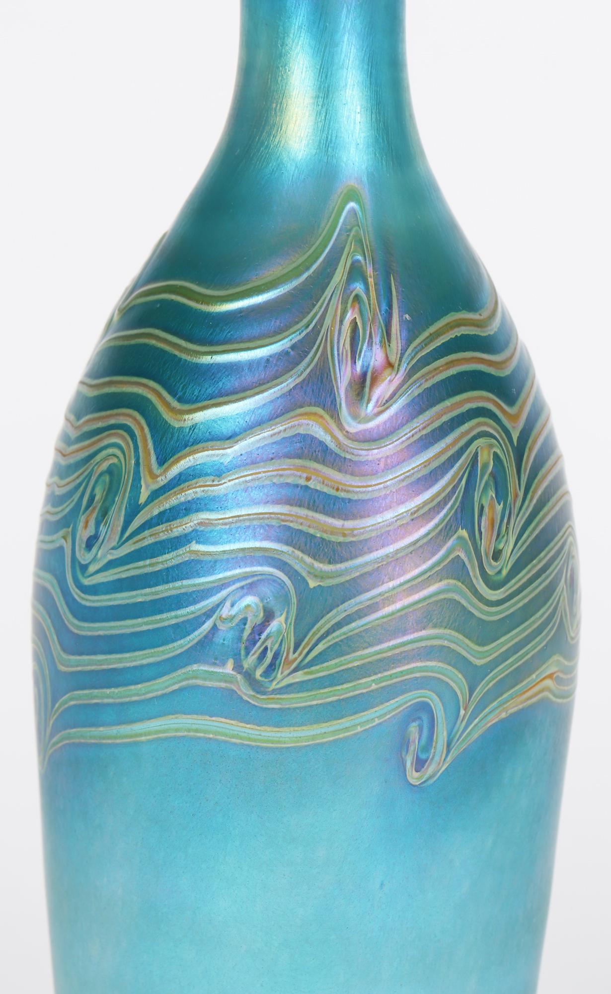 Hand-Crafted Iridescent Blue Bottle Shaped Art Glass Vase with Peacock Feather Trailing For Sale