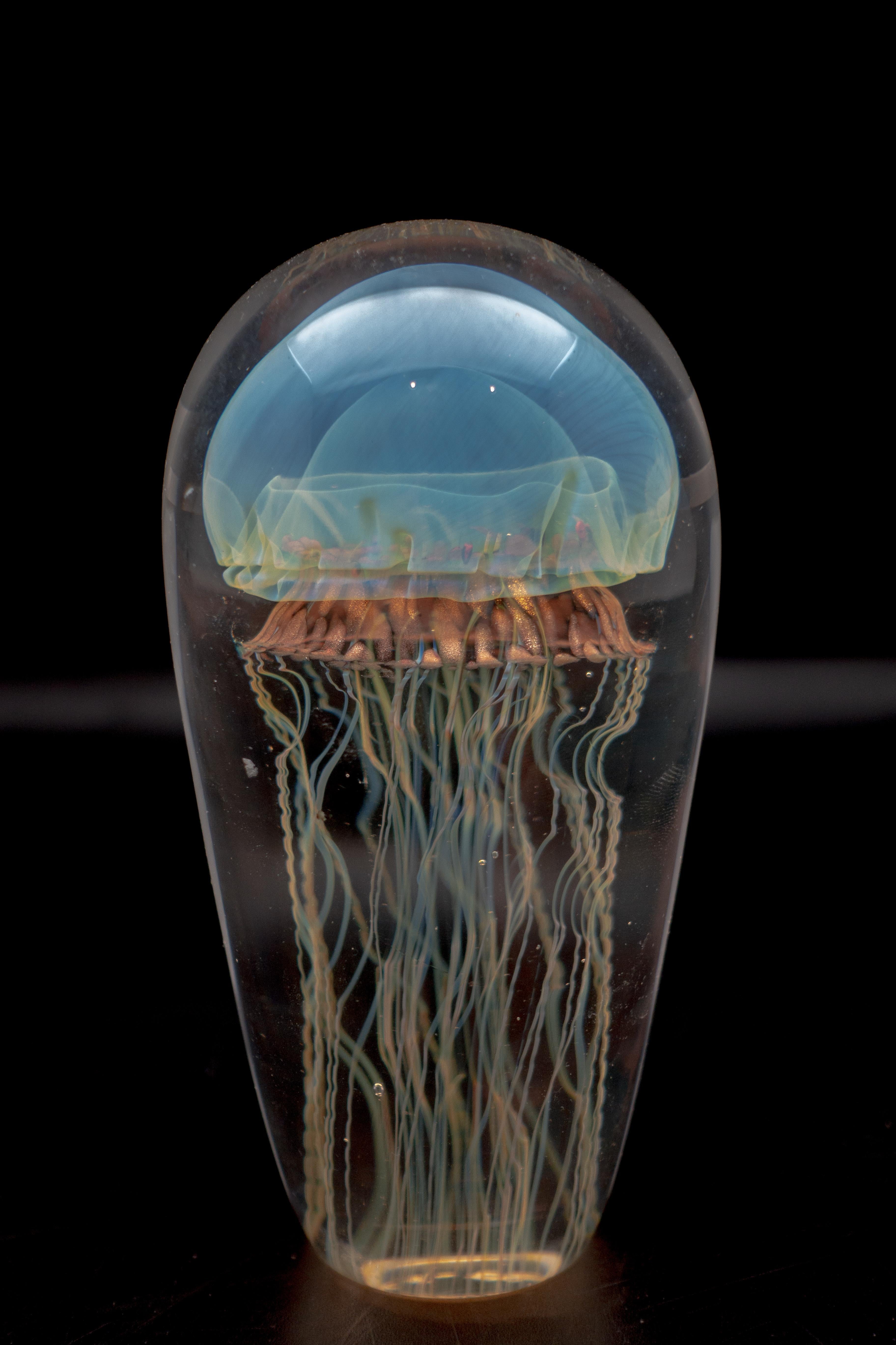 Handblown glass sculpture of jellyfish, in iridescent blue, made in the USA. Other color variations available.