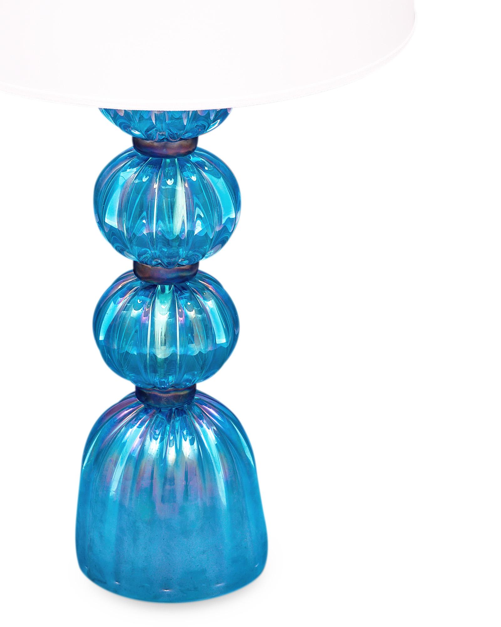 Pair of lamps from Murano, Italy made of hand-blown blue iridescent colored glass. They have been newly wired to fit US standards.