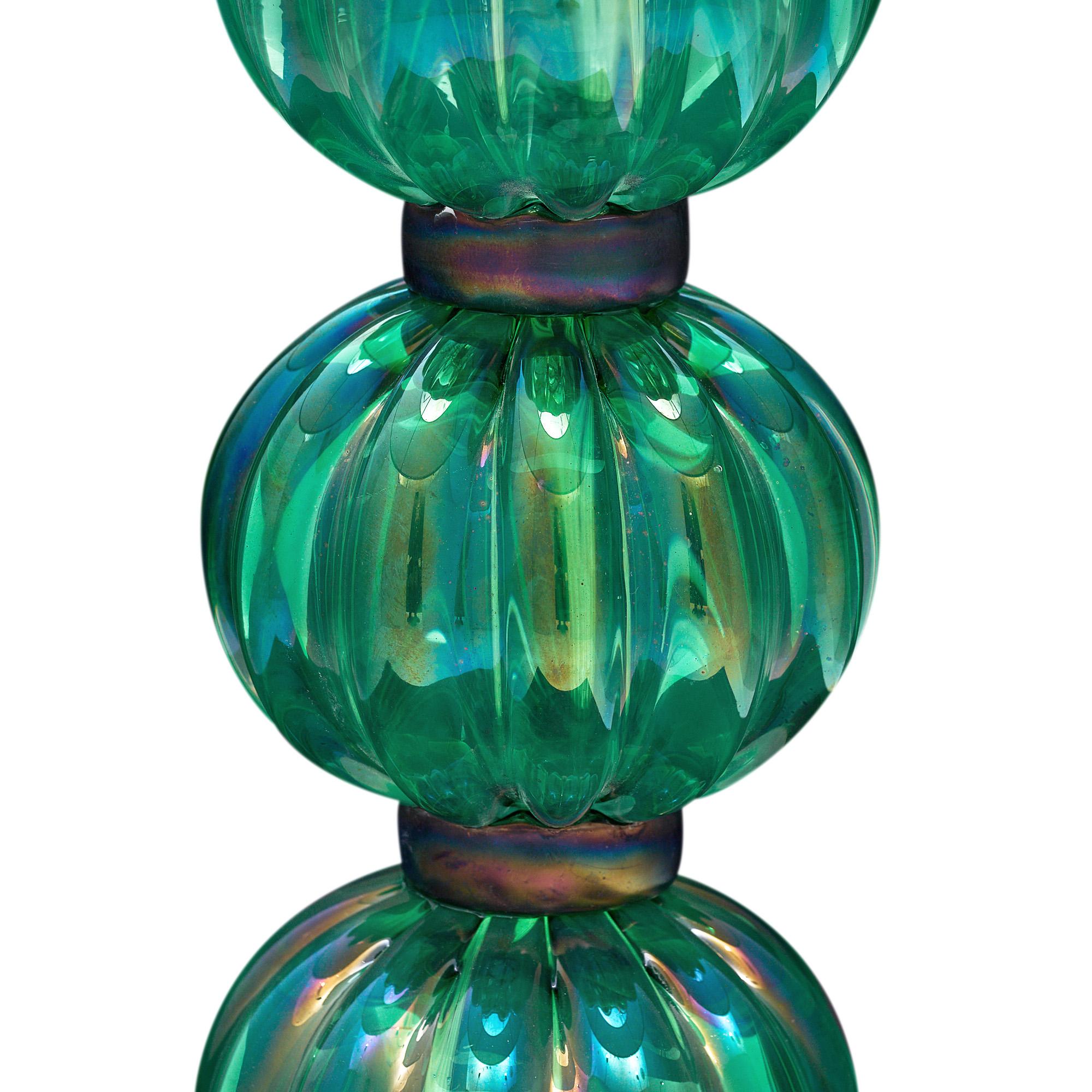 Pair of lamps from Murano, Italy made of hand-blown green emerald iridescent colored glass. They have been newly wired to fit US standards.