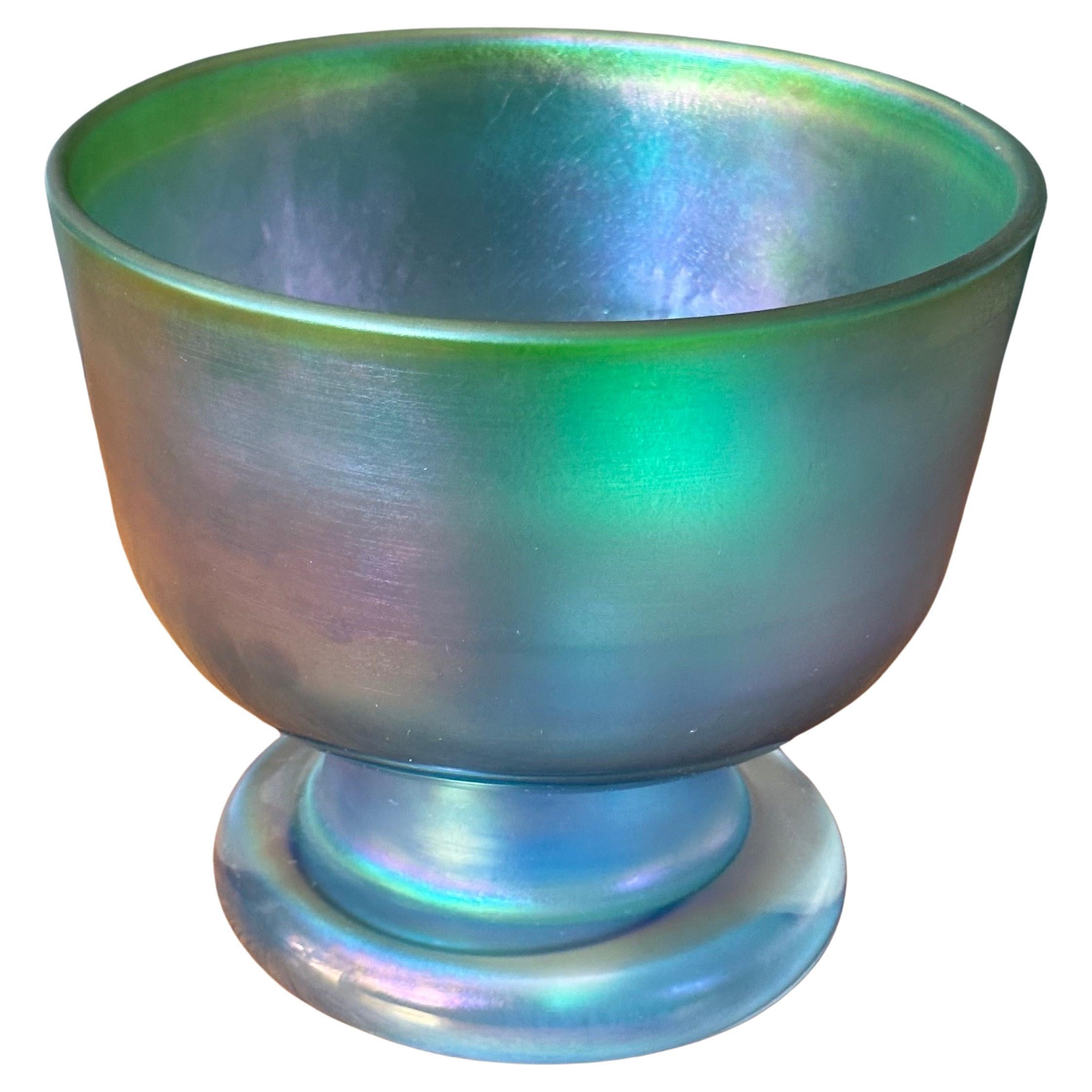 Stunning iridescent footed art glass vase / bowl by Bertil Vallien for Boda Abfors, circa 1980s.  The bowl is in very good vintage condition and measures 8