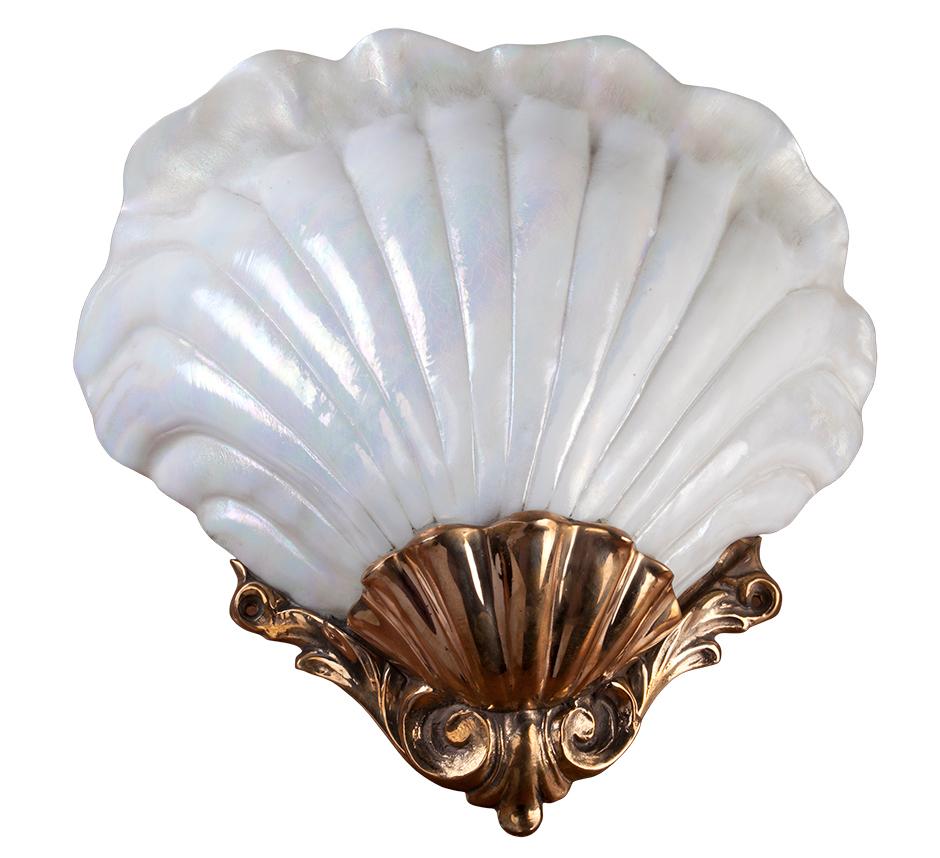 These are spectacular. From the decommissioned French cruise ship called the Ocean Gala, although she was originally Scandinavian. Large sconces with a scallop shell design in iridescent glass with a cast brass mounting. Electrification has been