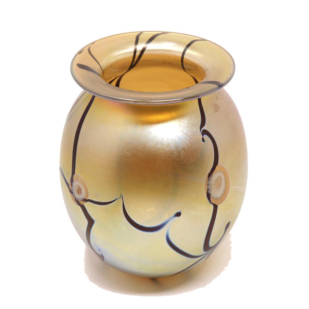 Iridescent glass vase by Robert Eickholt, signed Eickholt 1993, a bulbous form with gold iridescent surface punctuated by curving bronze stripes and circular cream motifs. 
Excellent condition.
Dimensions: H 5” (13 cm) x W 4” (10cm)
Weight: 12.5