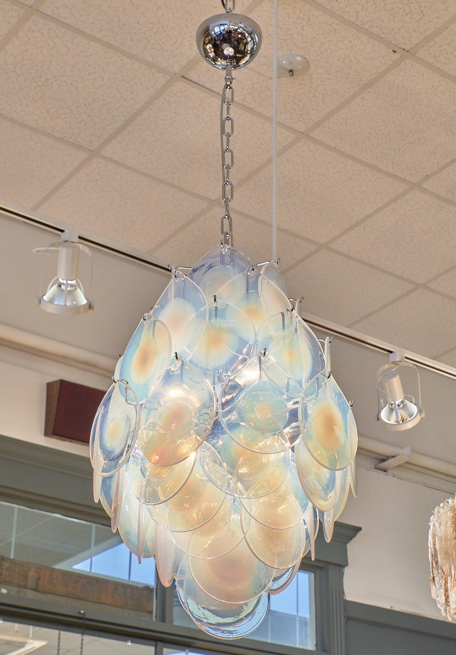 A Murano glass iridescent pendant chandelier featuring multiple spheres in the “girasole” iridescent color. This piece has been newly wired for US standards.