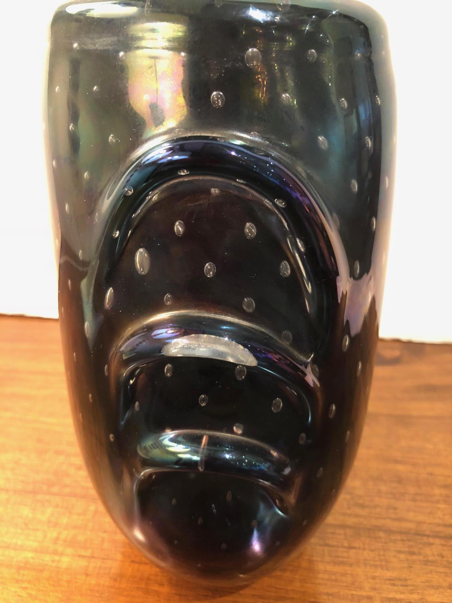 Iridescent Murano glass vase with imbedded bubbles in dark blue and purple.

Available to see in our NYC Showroom 
BK Antiques
306 East 61st St. 2nd fl.
New York, NY 10065