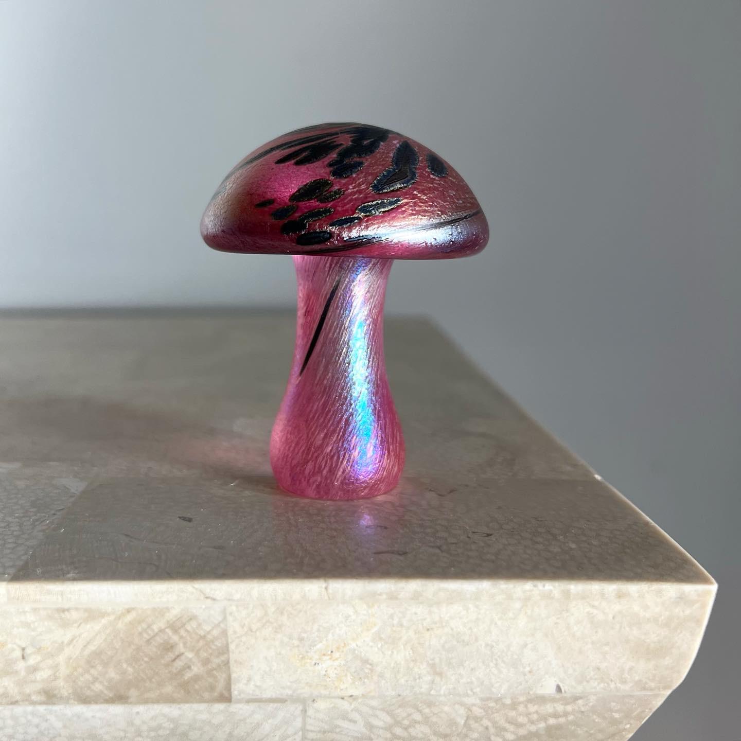 A gorgeous hand-crafted art glass mushroom objet d’art or paperweight, early aughts. Signed «K.Heaton» on bottom. Tones of dusk pink, marigold, and basalt. Flawless. Pick up in LA or worldwide shipping available.
Measures: 2.25” diameter x 3”