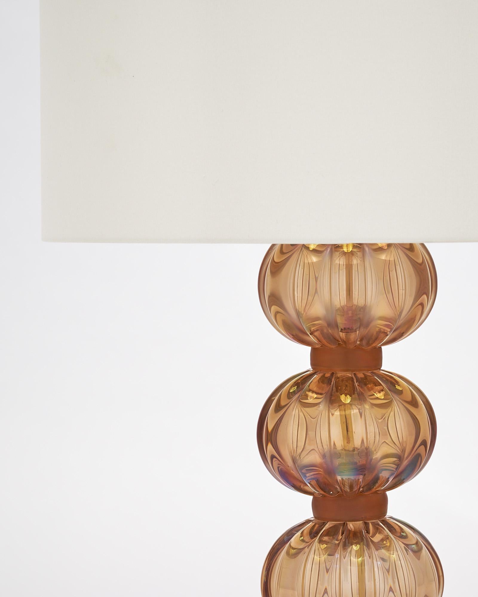 Single lamp from Murano, Italy made of hand-blown iridescent glass in a light smoked topaz color. It has been newly wired to fit US standards. Signed Alberto Dona.