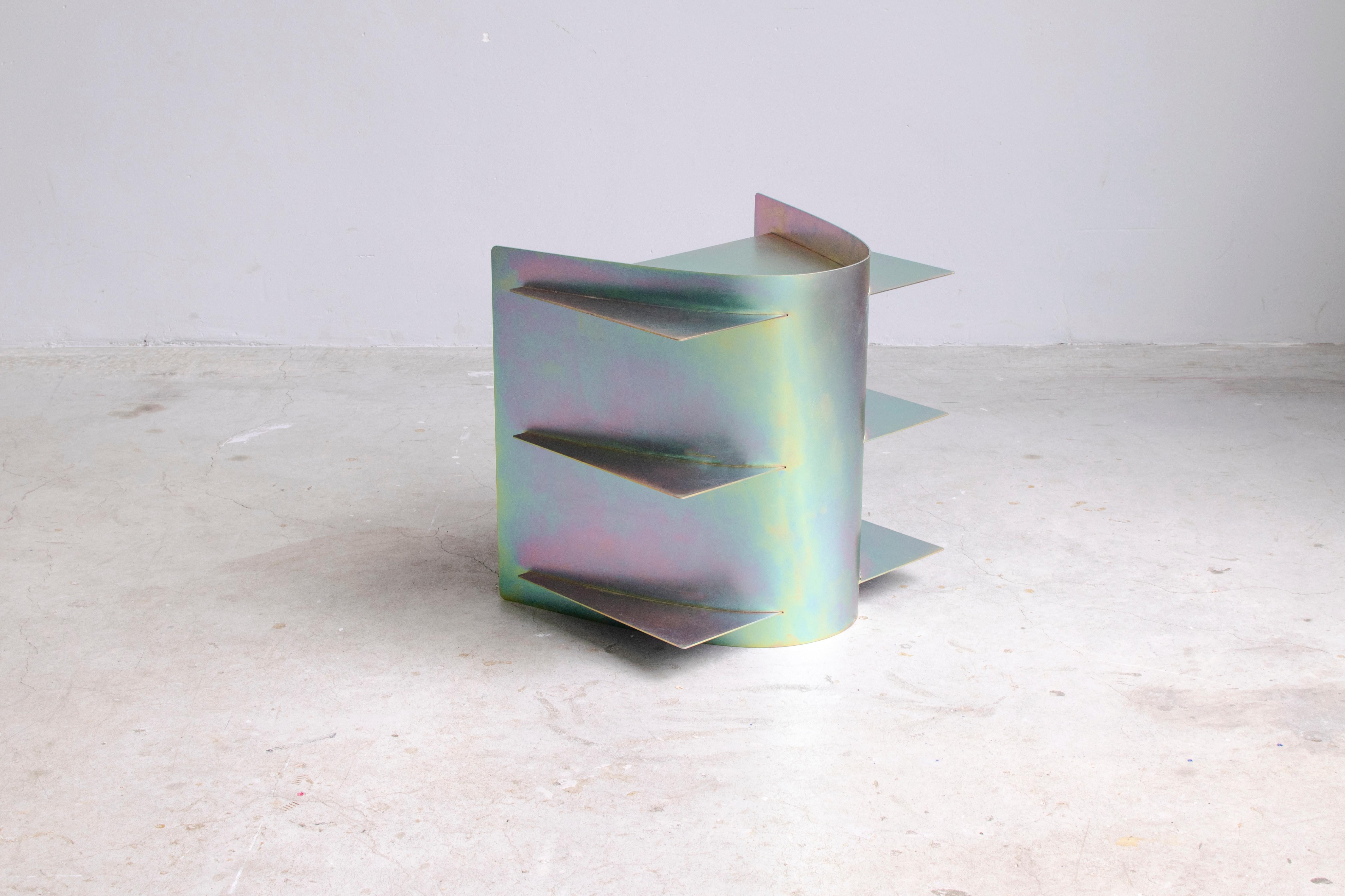 Iridescent Tension side table, Paul Coenen
Dimensions: 50 x 45 x 50 cm
Materials: Zinc-plated steel

Tension Collection The manufacturing industry is using standard sized material, and every machine used works according to these sizes.
Instead