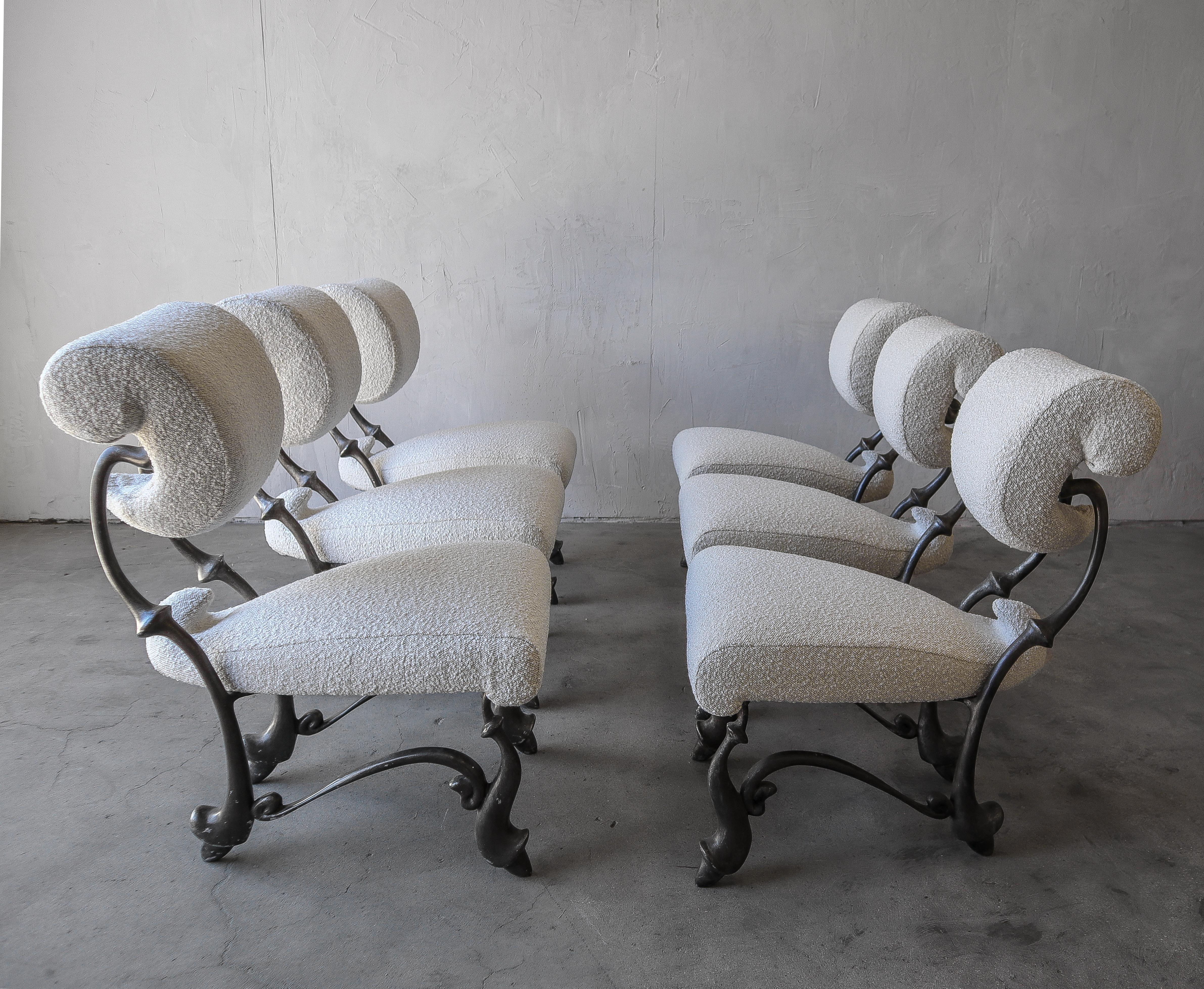 Absolutely incredible set of 6 Iridium ballet chairs, by Jordan Mozer. These chairs were created for the Iridium restaurant in New York in 1992. Cast out of solid, recycled aluminum-magnesium alloy, and upholstered in all new boucle fabric.

Looking