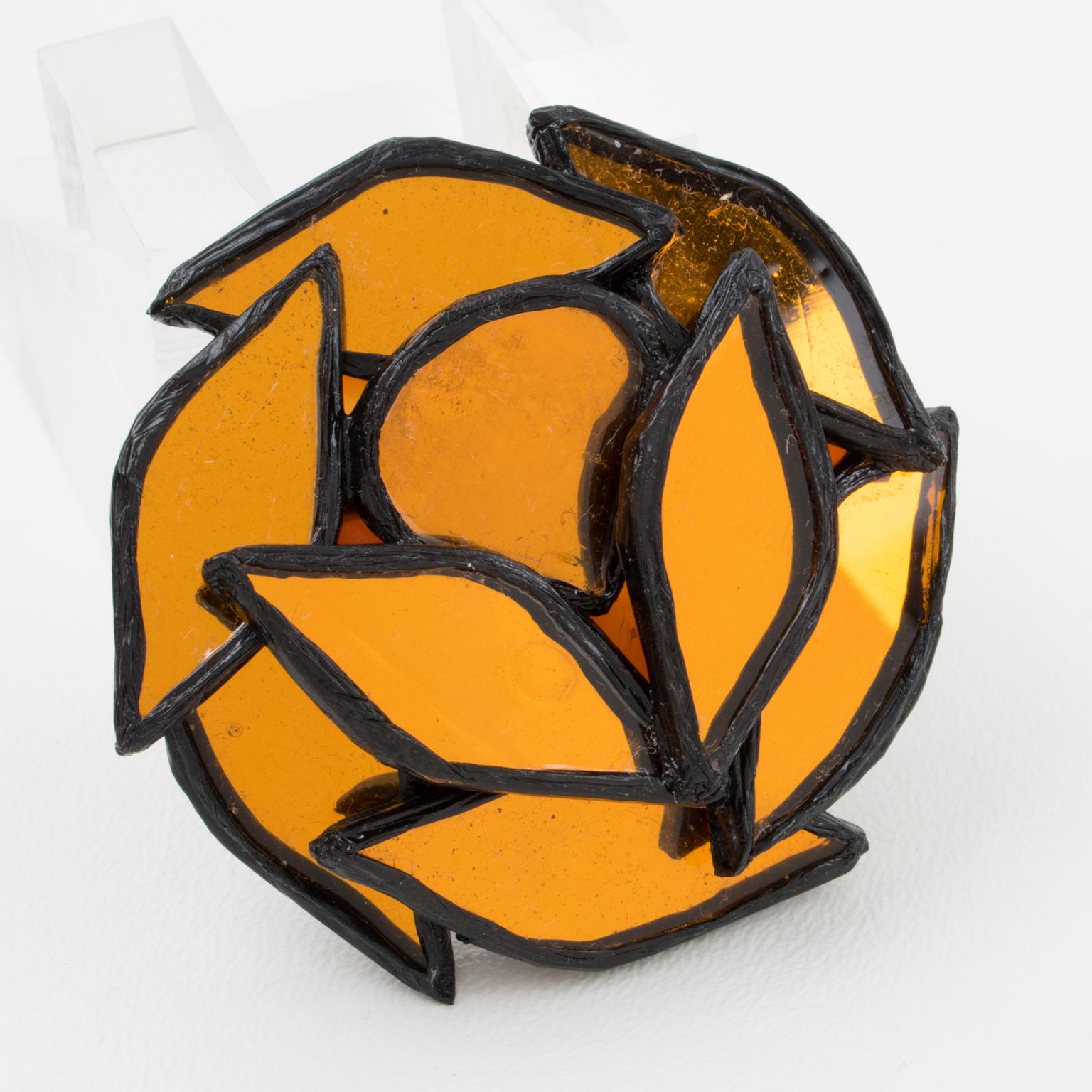 This charming Irena Jaworska Talosel or resin pin brooch features a dimensional geometric rounded shape in black resin framing, topped with a mosaic of mirrors in orange saffron color. Marked underside with the artist's monogram signature. Irena