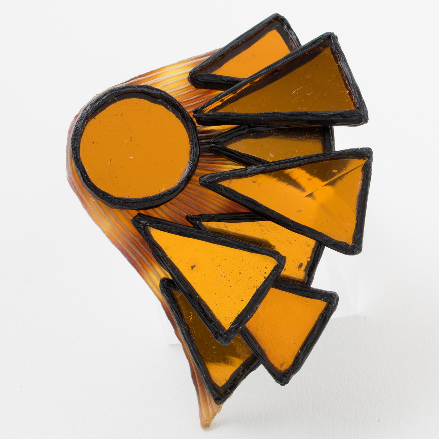 This adorable Irena Jaworska Talosel or resin pin brooch features a dimensional geometric fan shape in black resin framing, topped with a mosaic of mirrors in orange saffron color. The piece is marked underside with the artist's monogram signature.