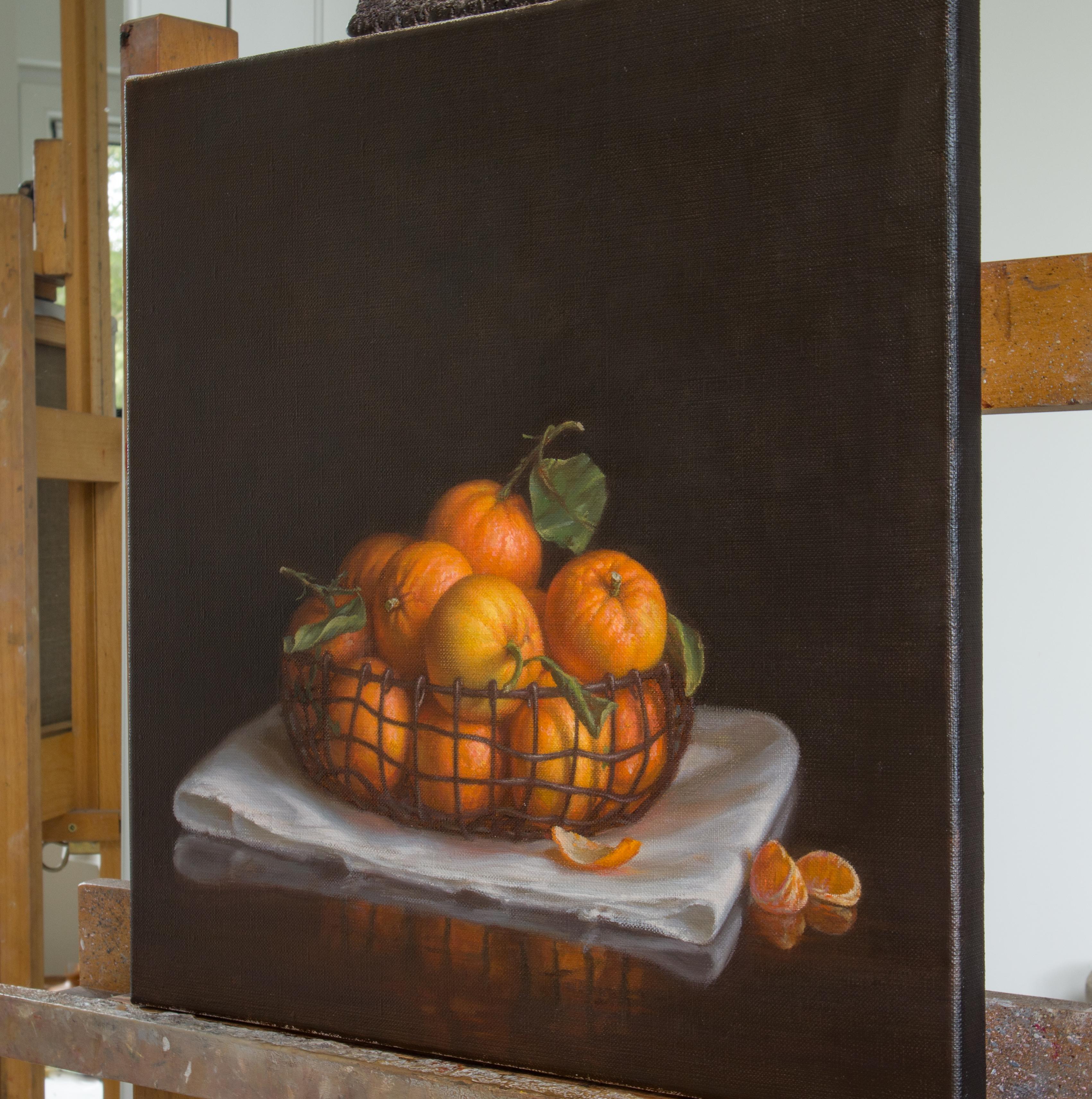 “Basket with tangerines” is a work that pays homage to the natural beauty and timeless elegance of this luscious fruit. Painted with great precision and a keen eye for detail, this masterpiece exudes a contemporary realism infused with the spirit of