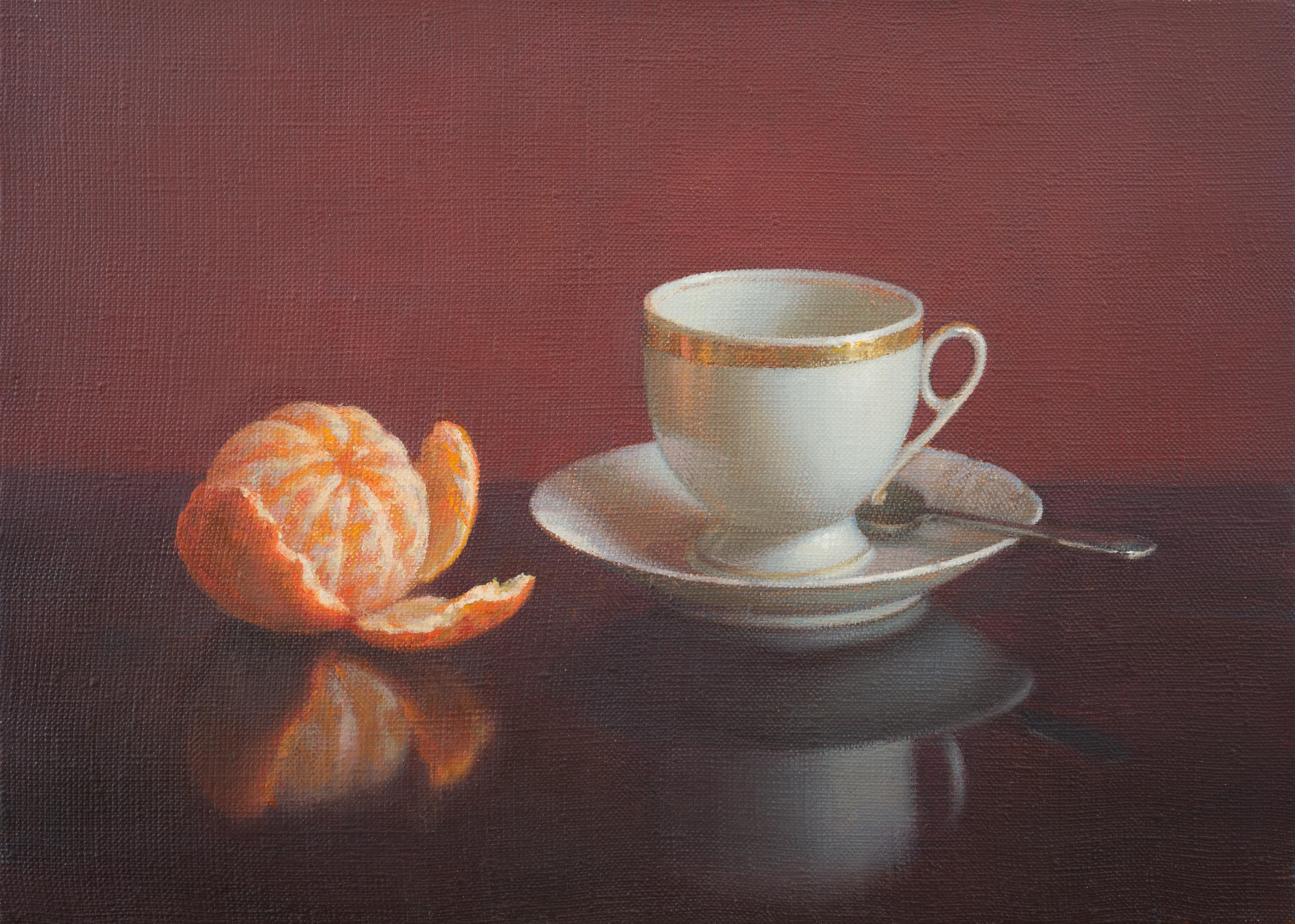 Cup of coffee and tangerine