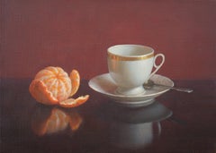 Tasse à café et tangerine
